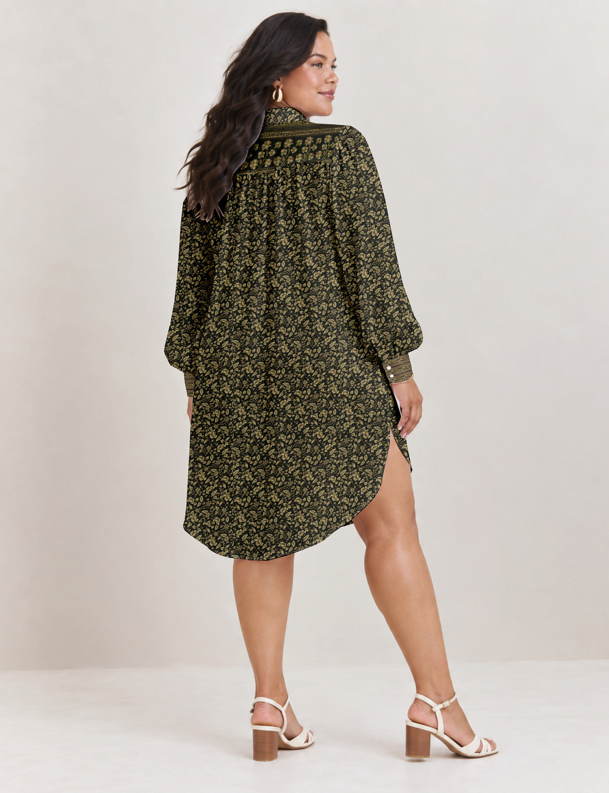 High low shirt with a relaxed fit, button-down front, classic collar, gathered shoulders and full-length blouson sleeves.