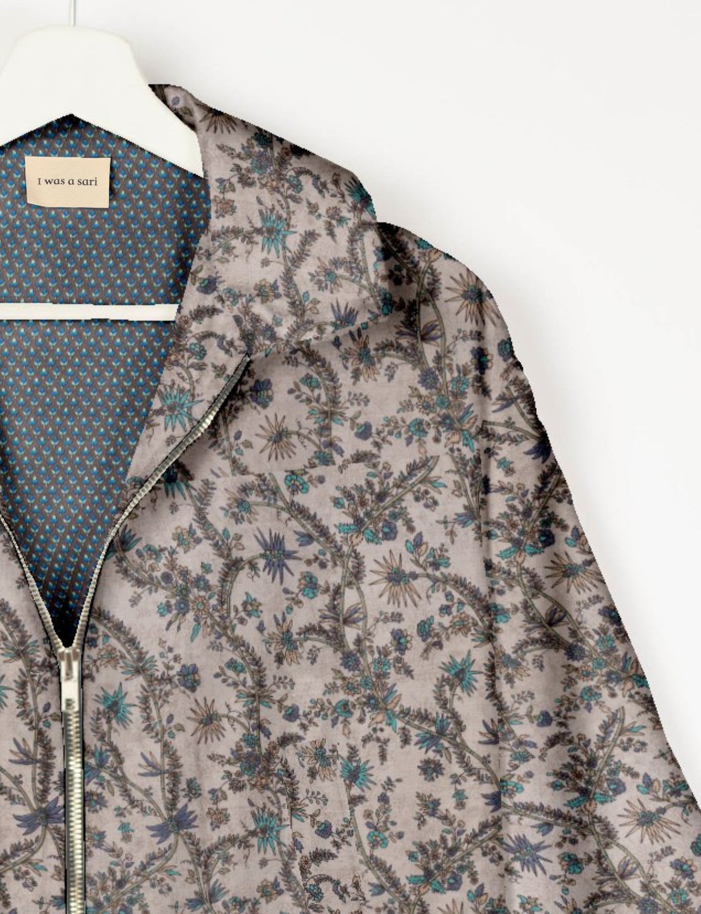 Upcycled Bomber Jacket made from recycled sari materials, featuring a cute cropped shape, elasticated hem and cuffs, and contrast sari print lining. Sustainable apparel promoting eco-friendly fashion and ethical clothing.