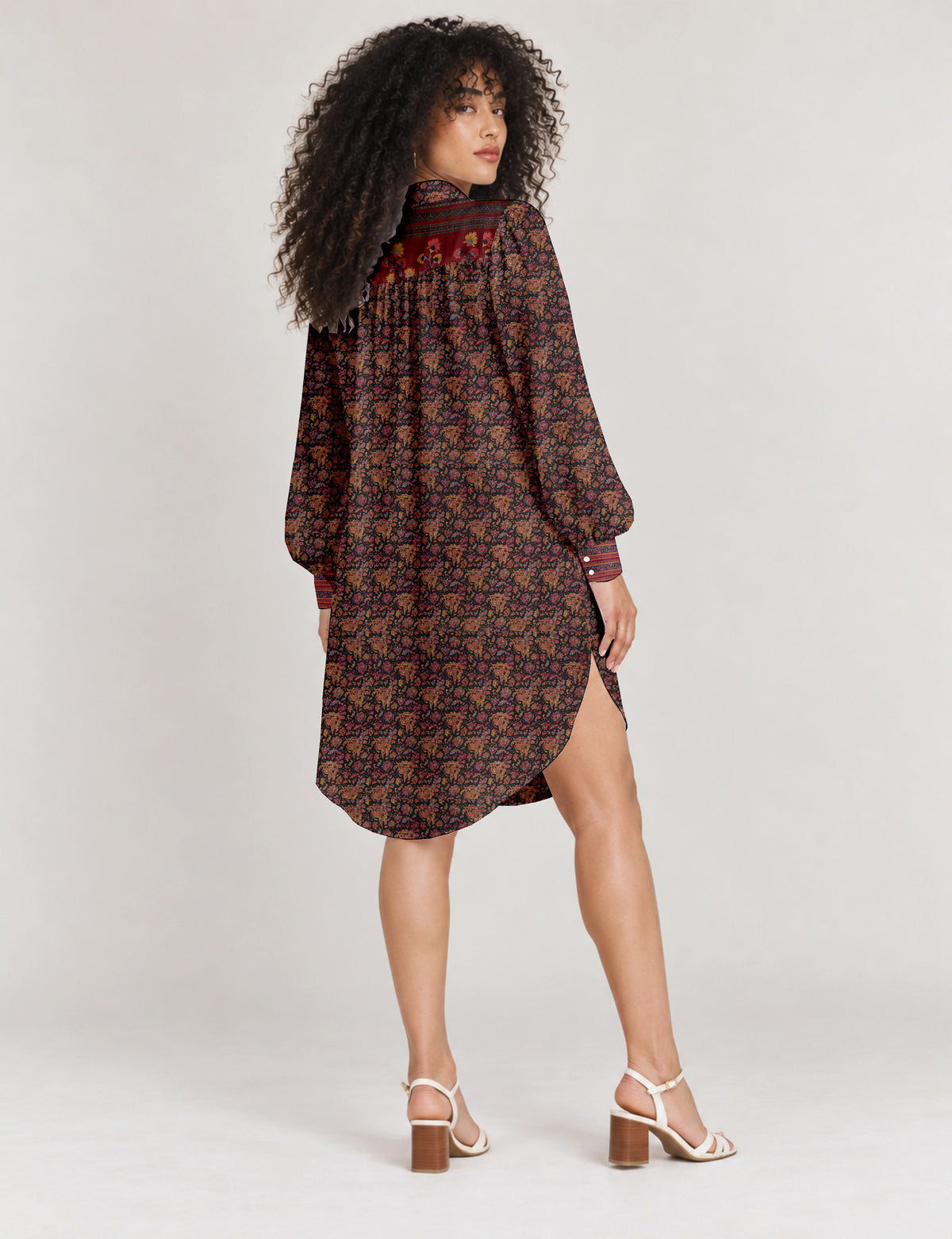 High low shirt with a relaxed fit, button-down front, classic collar, gathered shoulders and full-length blouson sleeves.