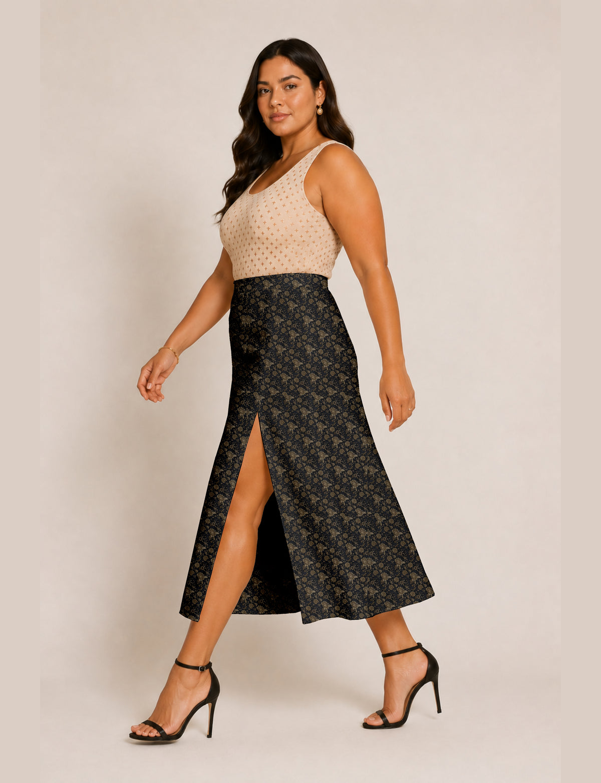 Woman wearing a yellow and navy blue A-line skirt with a slit and a sleeveless beige top with brown micro print