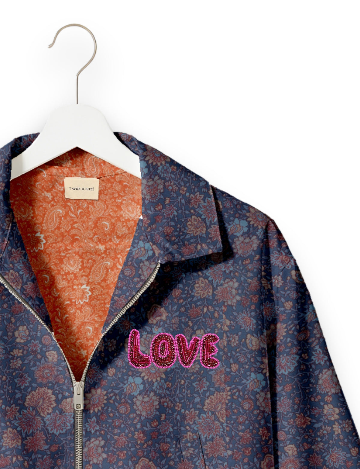 Love Bomber Jacket made from recycled fabric, featuring hand-stitched Aari embroidery. A unique piece of zero-waste clothing, part of the circular fashion movement. Designed with upcycled materials for a stylish yet environmentally friendly clothing choice.