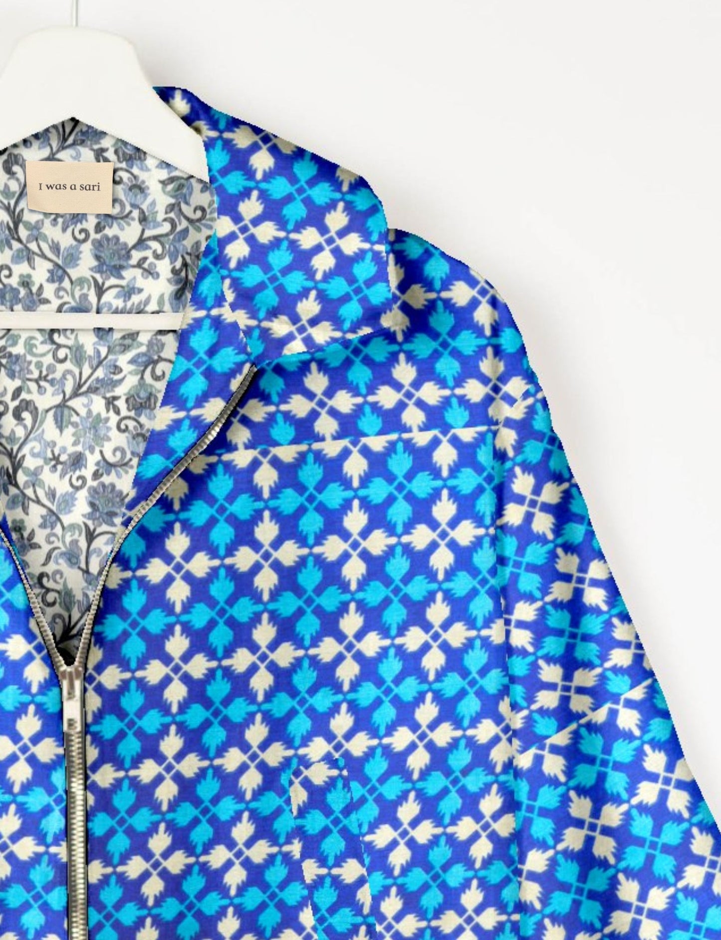 Upcycled Bomber Jacket made from recycled sari materials, featuring a cute cropped shape, elasticated hem and cuffs, and contrast sari print lining. Sustainable apparel promoting eco-friendly fashion and ethical clothing.