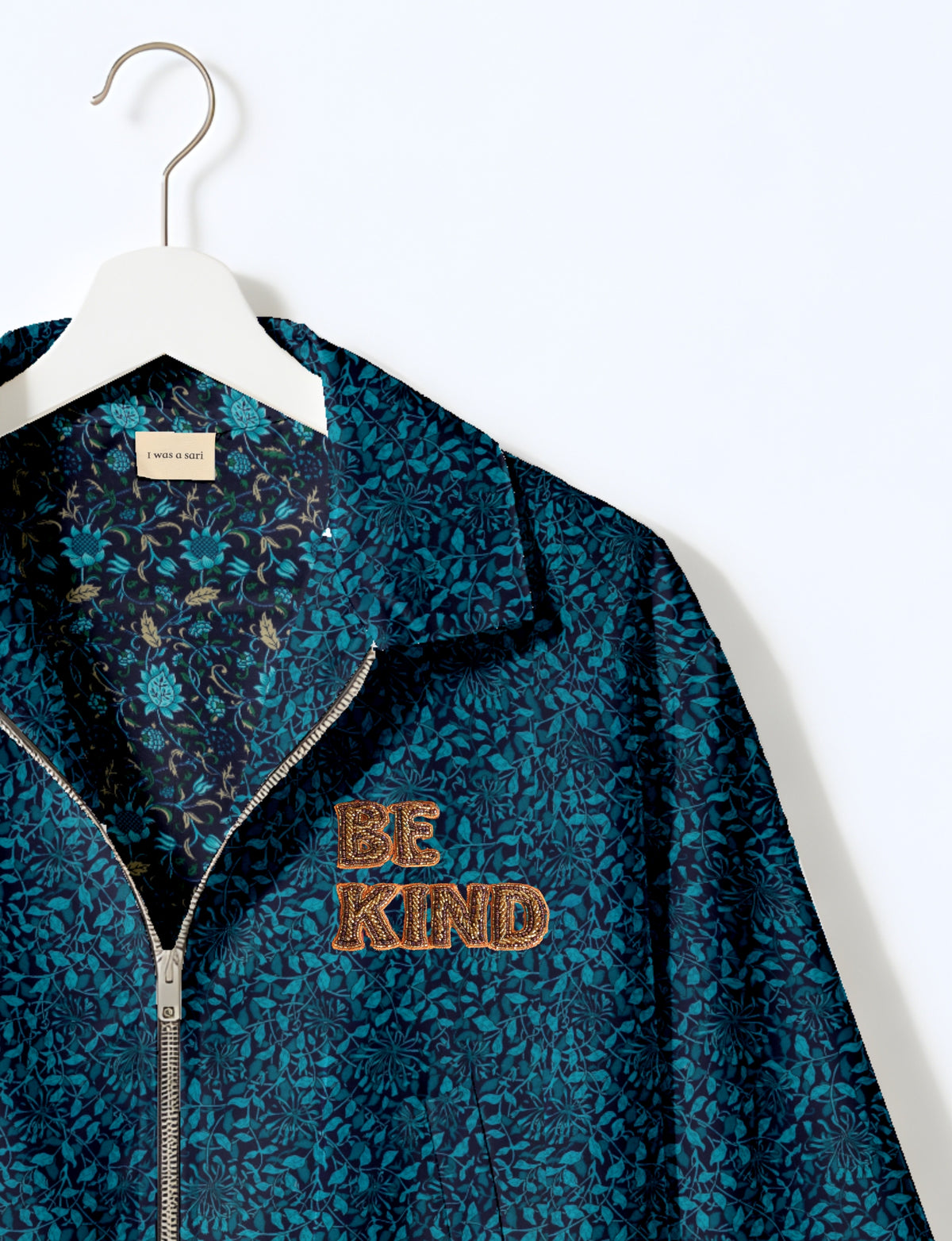 BE KIND Bomber jacket made from upcycled sari fabric with handcrafted Aari embroidery by female artisans.
