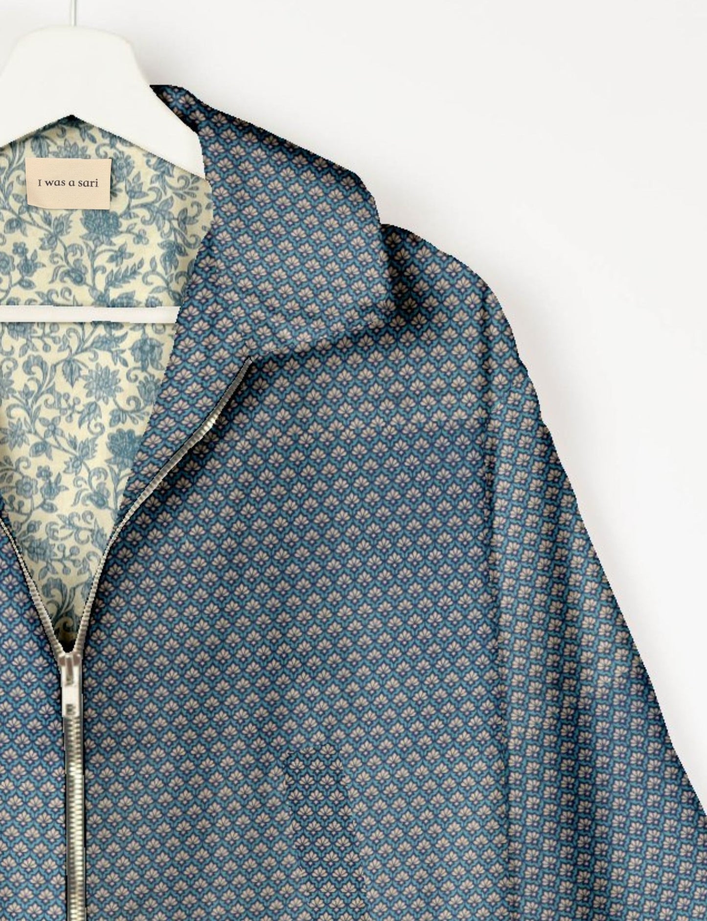 Upcycled Bomber Jacket made from recycled sari materials, featuring a cute cropped shape, elasticated hem and cuffs, and contrast sari print lining. Sustainable apparel promoting eco-friendly fashion and ethical clothing.