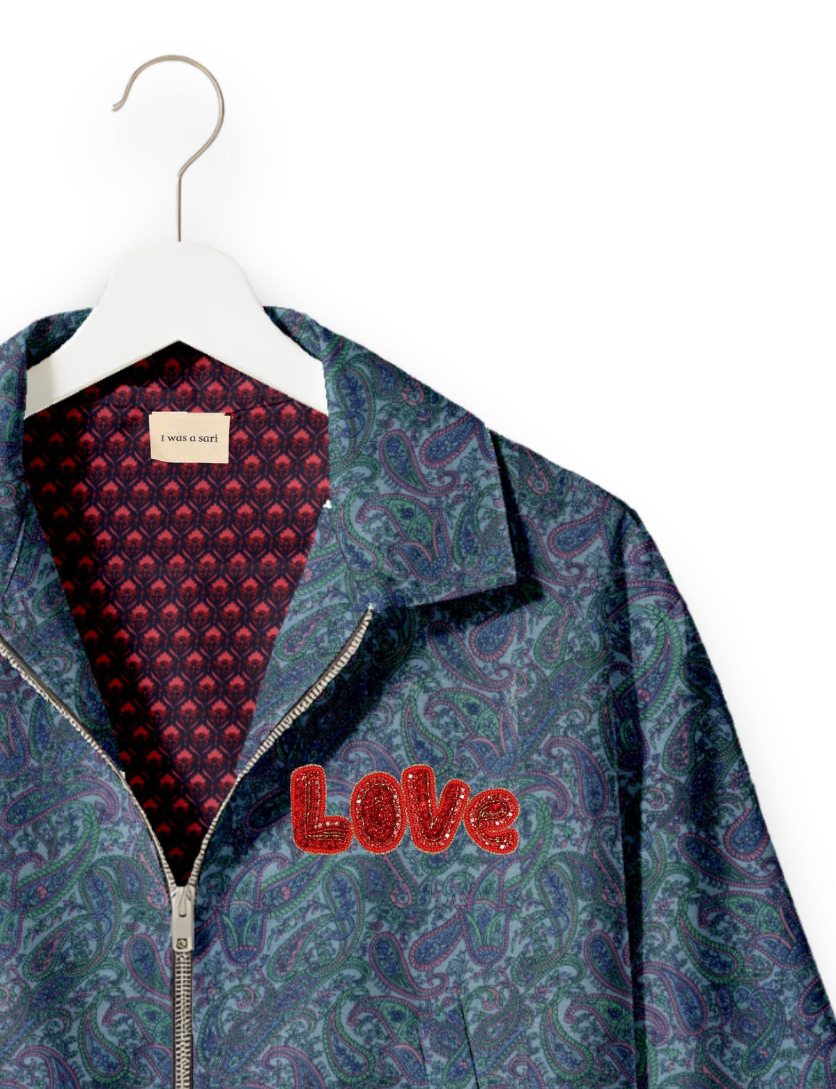 Love Bomber Jacket made from recycled fabric, featuring hand-stitched Aari embroidery. A unique piece of zero-waste clothing, part of the circular fashion movement. Designed with upcycled materials for a stylish yet environmentally friendly clothing choice.