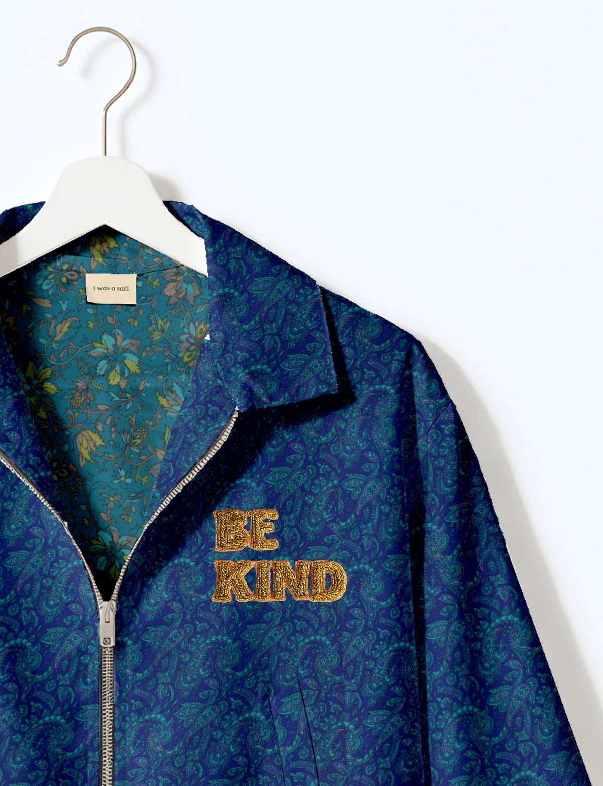 BE KIND Bomber jacket made from upcycled sari fabric with handcrafted Aari embroidery by female artisans.
