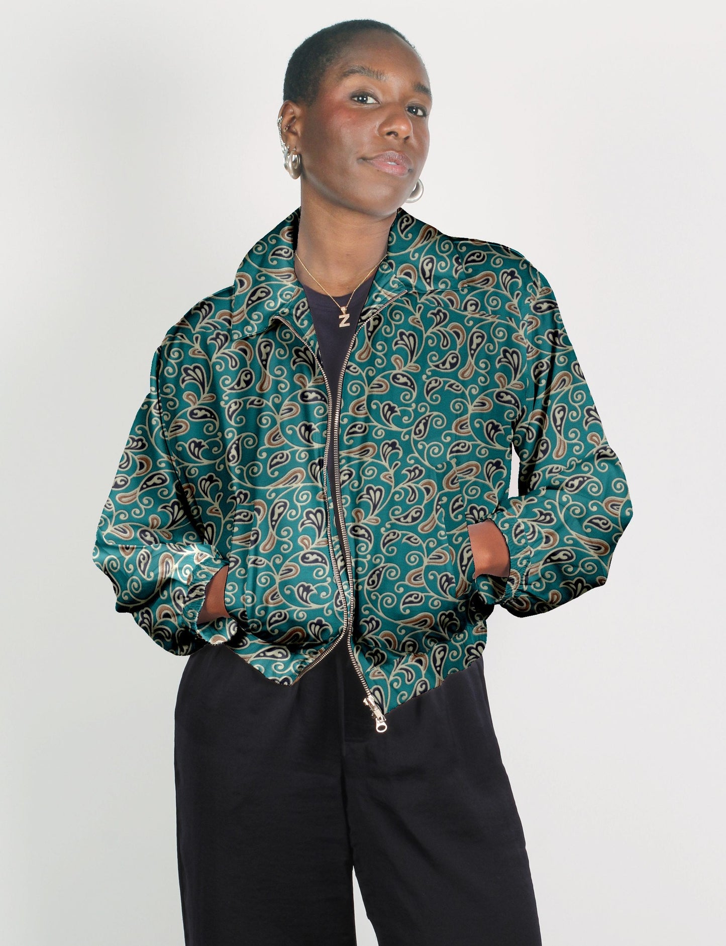 Upcycled Bomber Jacket made from recycled sari materials, featuring a cute cropped shape, elasticated hem and cuffs, and contrast sari print lining. Sustainable apparel promoting eco-friendly fashion and ethical clothing.