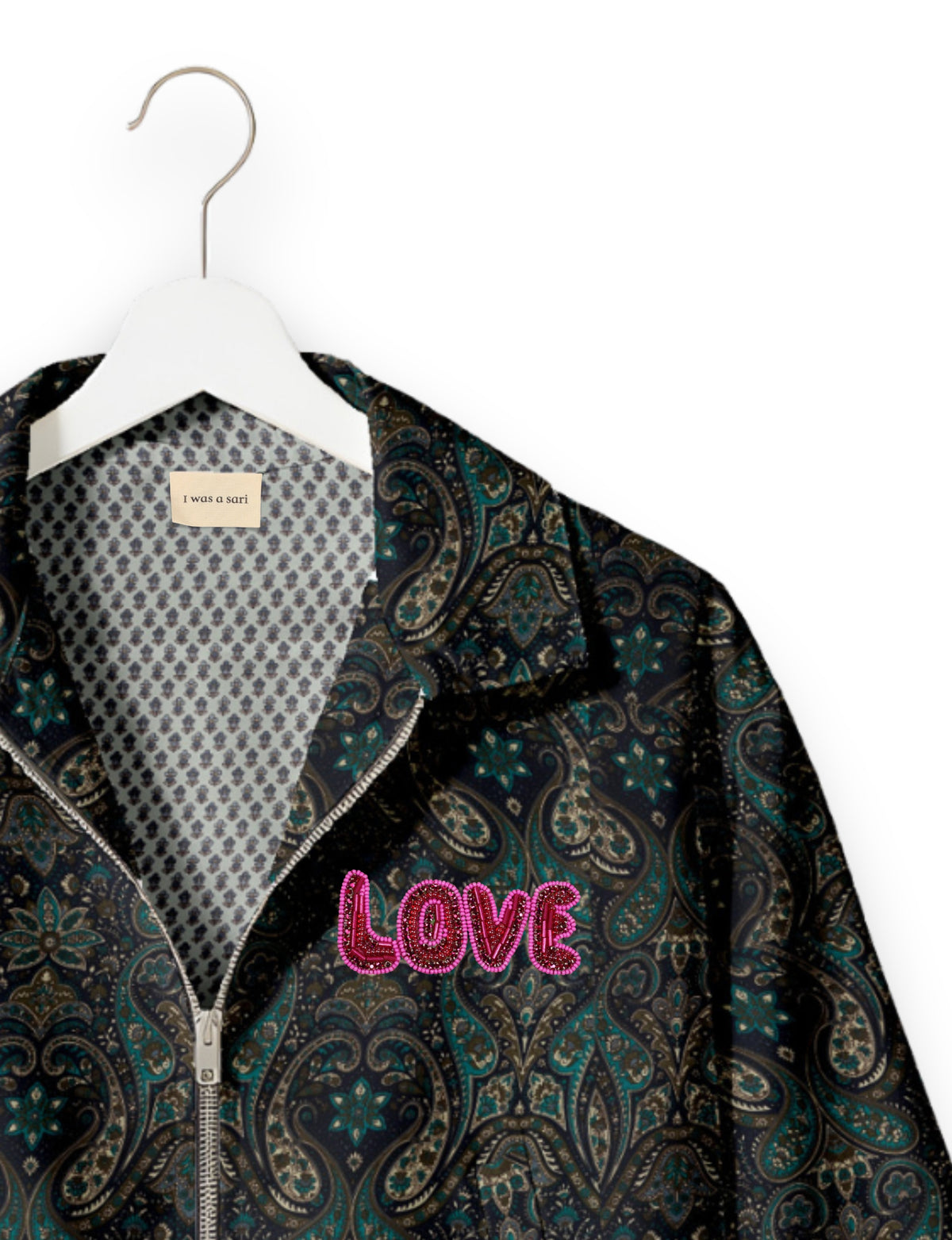 Love Bomber Jacket made from recycled fabric, featuring hand-stitched Aari embroidery. A unique piece of zero-waste clothing, part of the circular fashion movement. Designed with upcycled materials for a stylish yet environmentally friendly clothing choice.