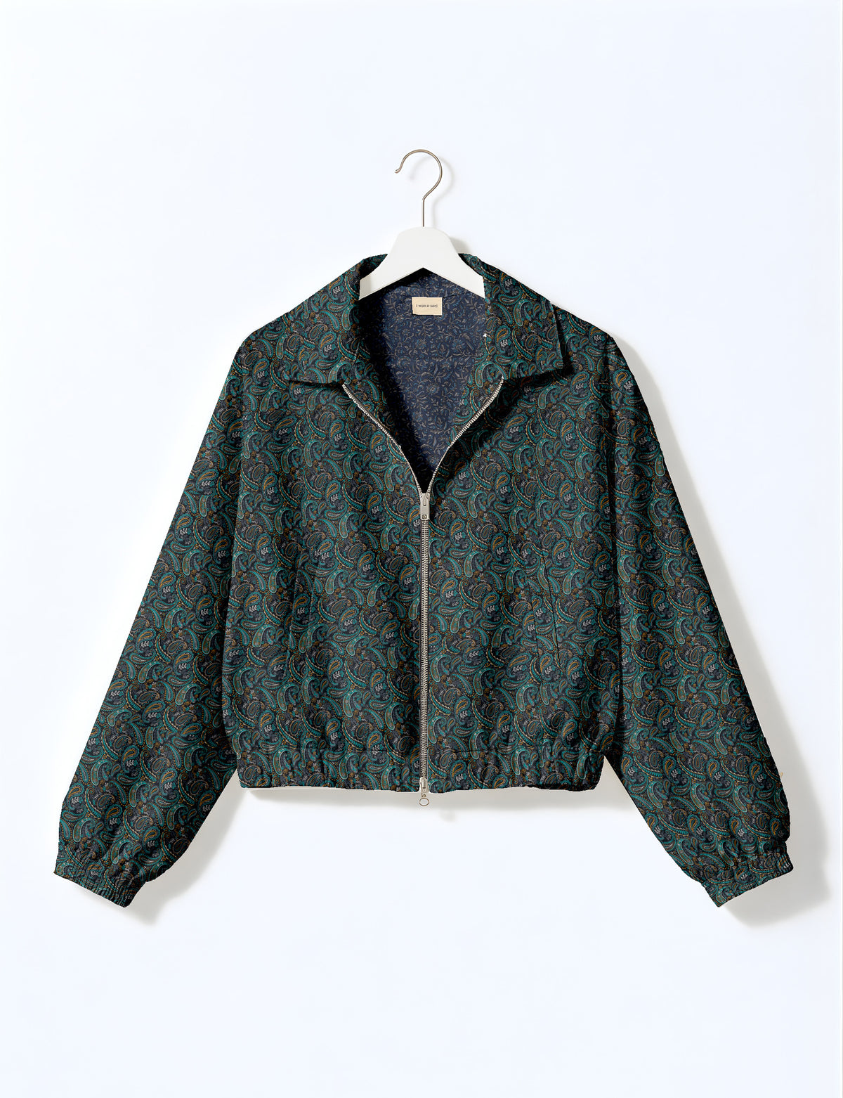 Brown floral bomber jacket with front zipper, elastic cuffs and hem, hanging on white hanger, red floral inner lining visible