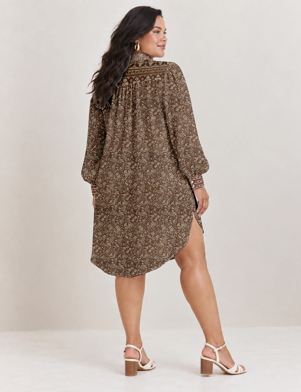High low shirt with a relaxed fit, button-down front, classic collar, gathered shoulders and full-length blouson sleeves.