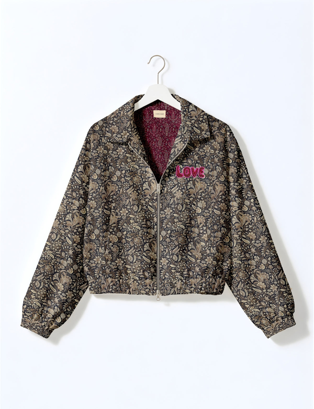 Love Bomber Jacket made from recycled fabric, featuring hand-stitched Aari embroidery. A unique piece of zero-waste clothing, part of the circular fashion movement. Designed with upcycled materials for a stylish yet environmentally friendly clothing choice.