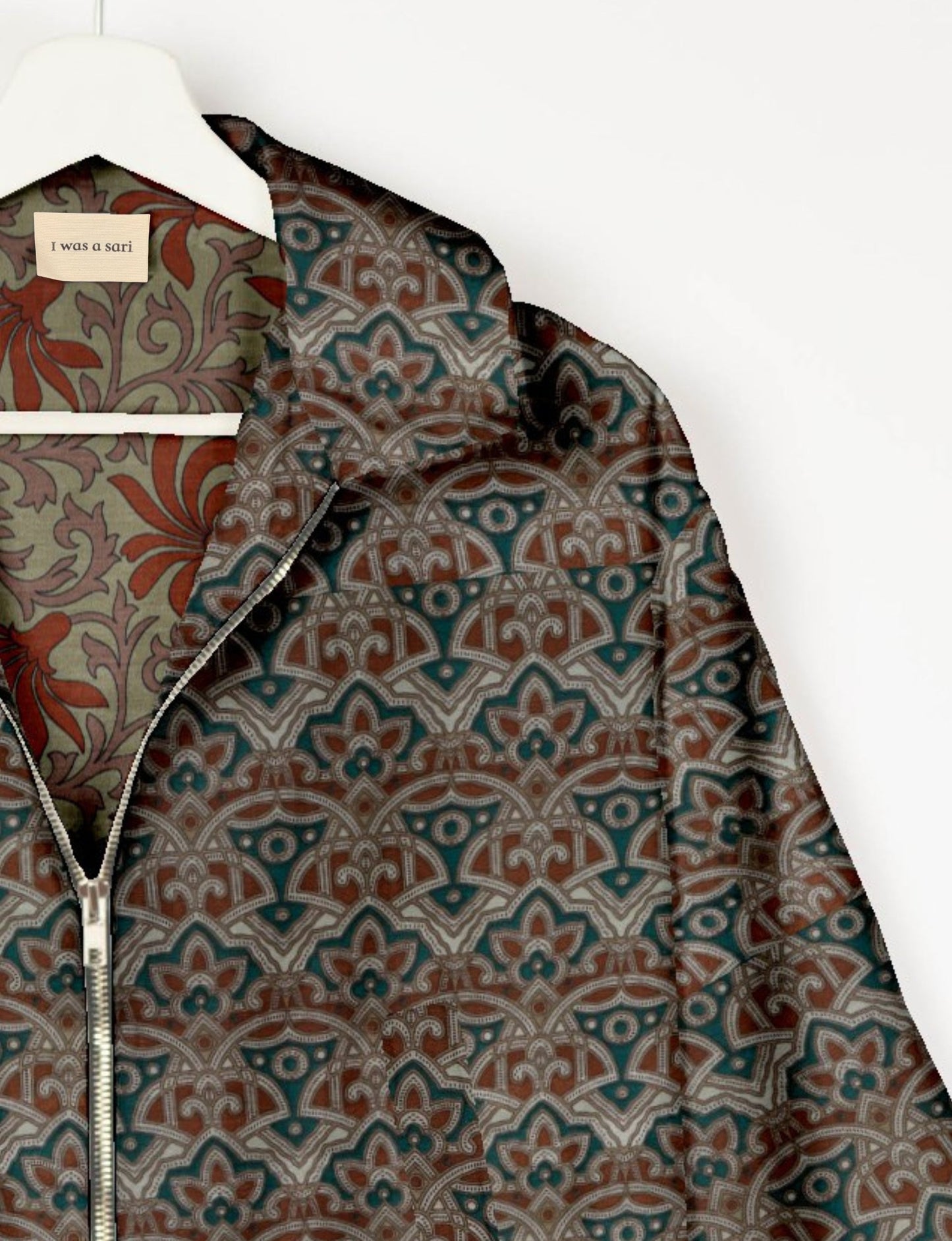 Upcycled Bomber Jacket made from recycled sari materials, featuring a cute cropped shape, elasticated hem and cuffs, and contrast sari print lining. Sustainable apparel promoting eco-friendly fashion and ethical clothing.