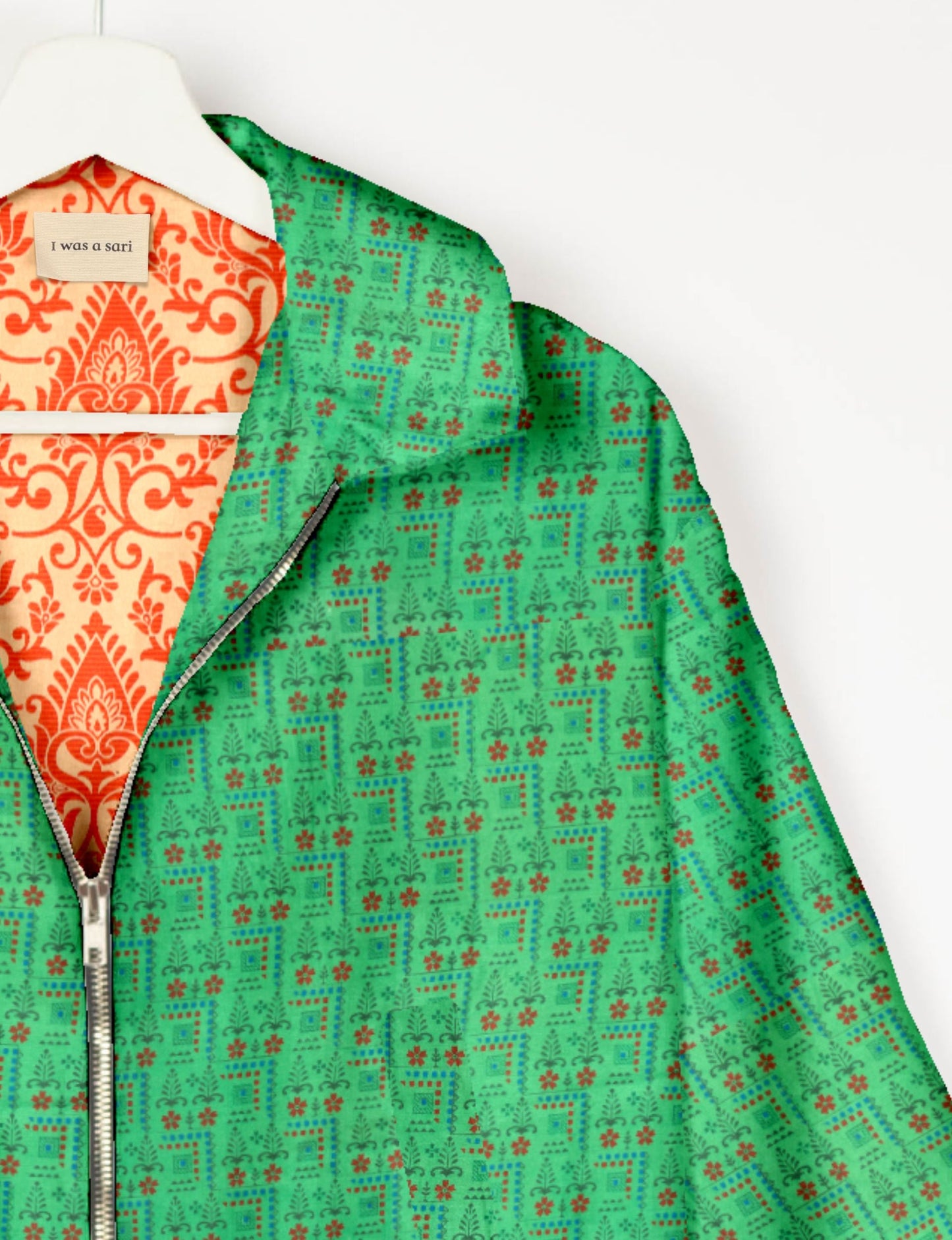 Upcycled Bomber Jacket made from recycled sari materials, featuring a cute cropped shape, elasticated hem and cuffs, and contrast sari print lining. Sustainable apparel promoting eco-friendly fashion and ethical clothing.