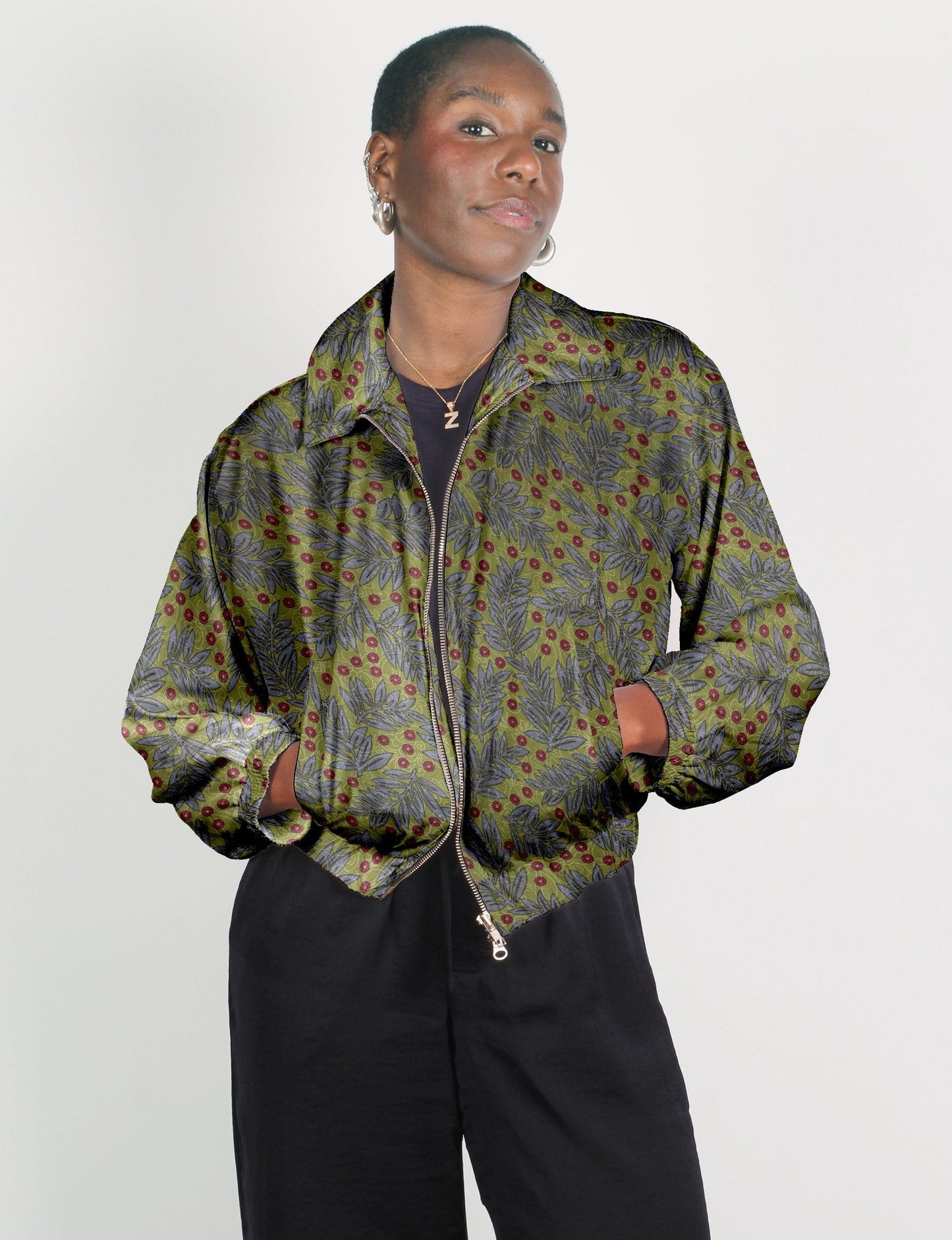 Upcycled Bomber Jacket made from recycled sari materials, featuring a cute cropped shape, elasticated hem and cuffs, and contrast sari print lining. Sustainable apparel promoting eco-friendly fashion and ethical clothing.