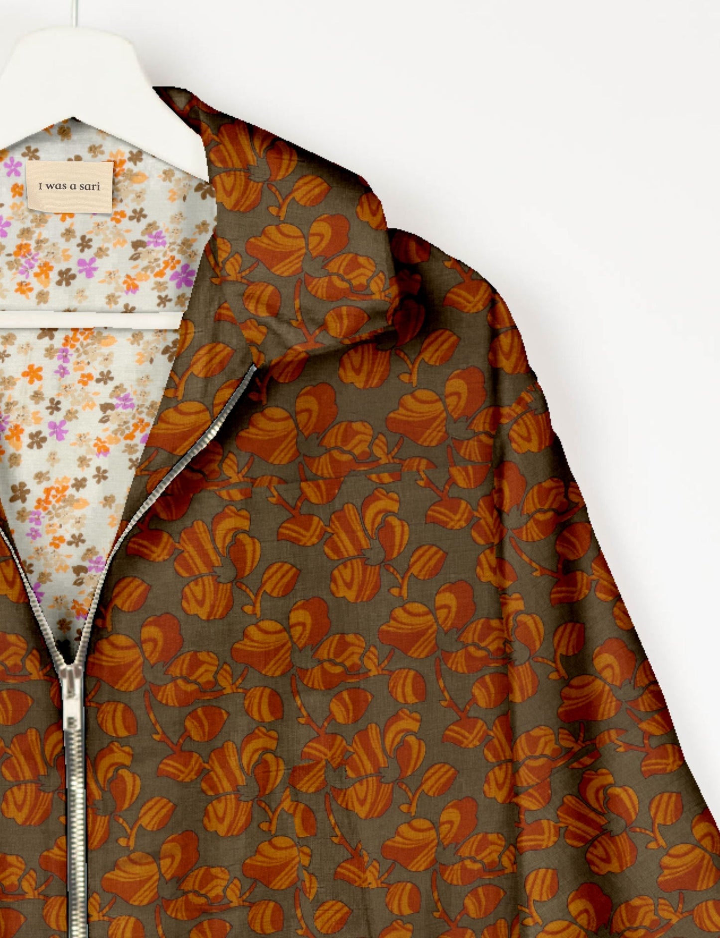 Upcycled Bomber Jacket made from recycled sari materials, featuring a cute cropped shape, elasticated hem and cuffs, and contrast sari print lining. Sustainable apparel promoting eco-friendly fashion and ethical clothing.