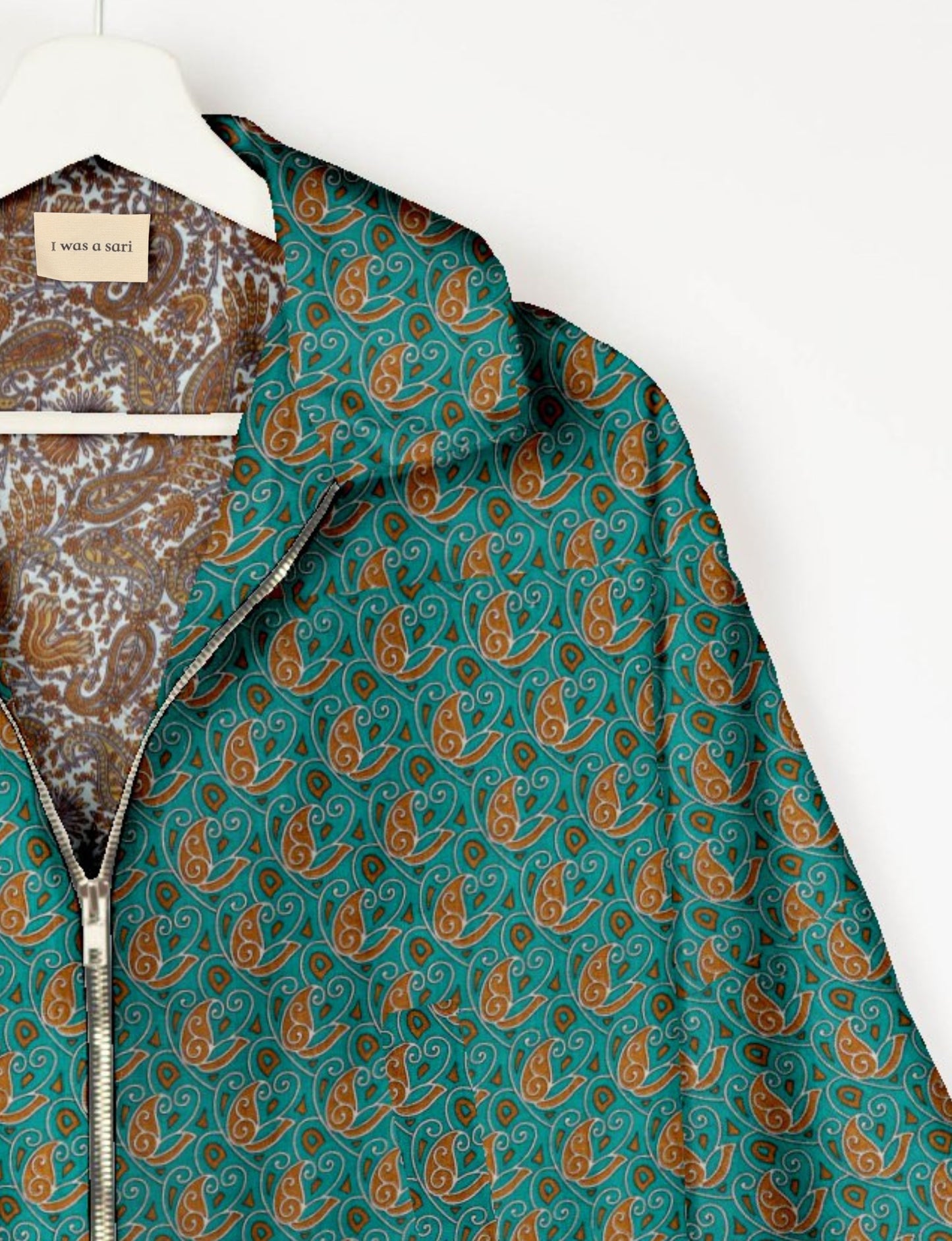 Upcycled Bomber Jacket made from recycled sari materials, featuring a cute cropped shape, elasticated hem and cuffs, and contrast sari print lining. Sustainable apparel promoting eco-friendly fashion and ethical clothing.