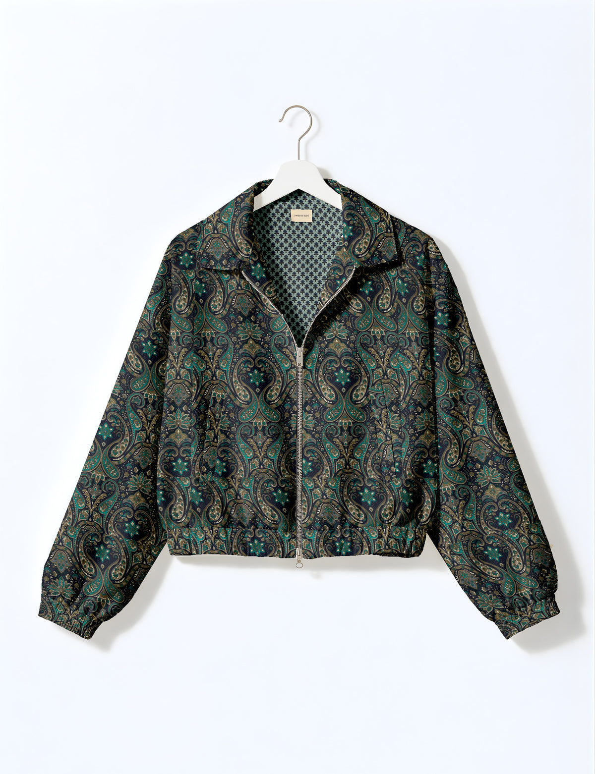 Brown floral bomber jacket with front zipper, elastic cuffs and hem, hanging on white hanger, red floral inner lining visible