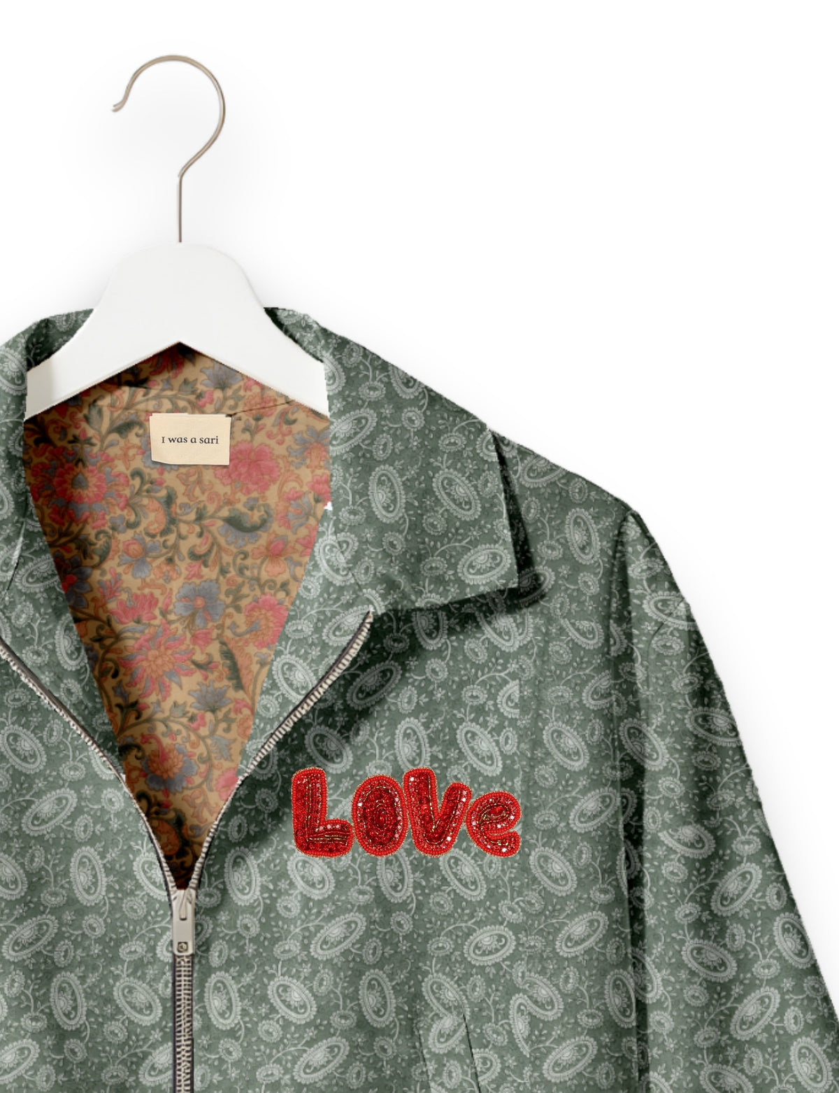 Love Bomber Jacket made from recycled fabric, featuring hand-stitched Aari embroidery. A unique piece of zero-waste clothing, part of the circular fashion movement. Designed with upcycled materials for a stylish yet environmentally friendly clothing choice.