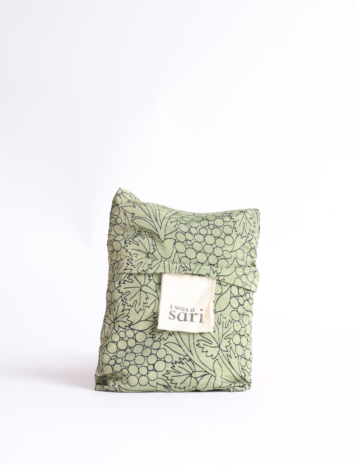 Blue reusable bag with tropical floral pattern in pink, yellow, and green, shown hanging with handles visible