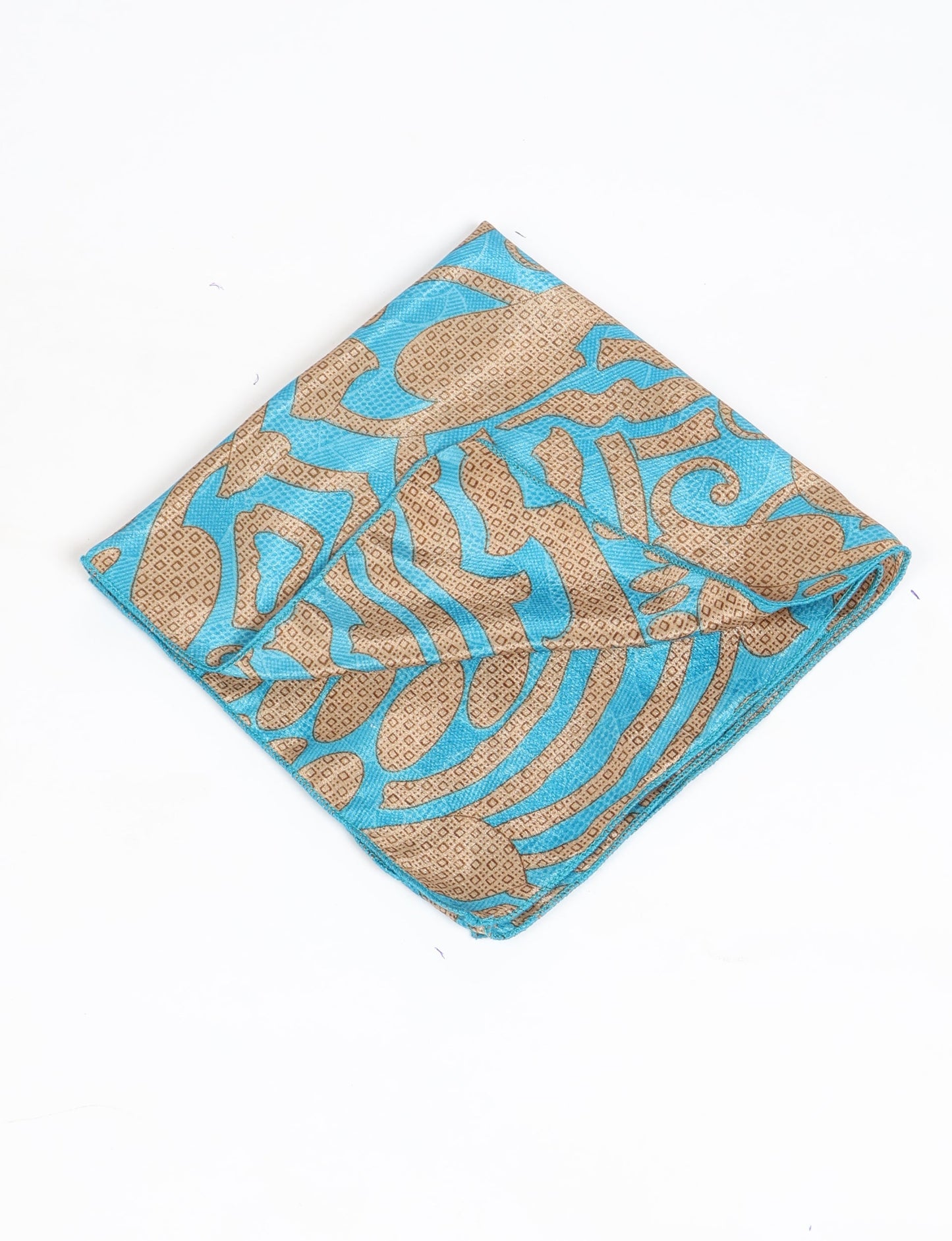 A delicately handcrafted wrap made from recycled sari offcuts, blending sustainable fashion with conscious design. This eco-friendly product showcases the beauty of upcycling and green fashion, making it a perfect accessory for those supporting circular fashion and products made from textile waste.