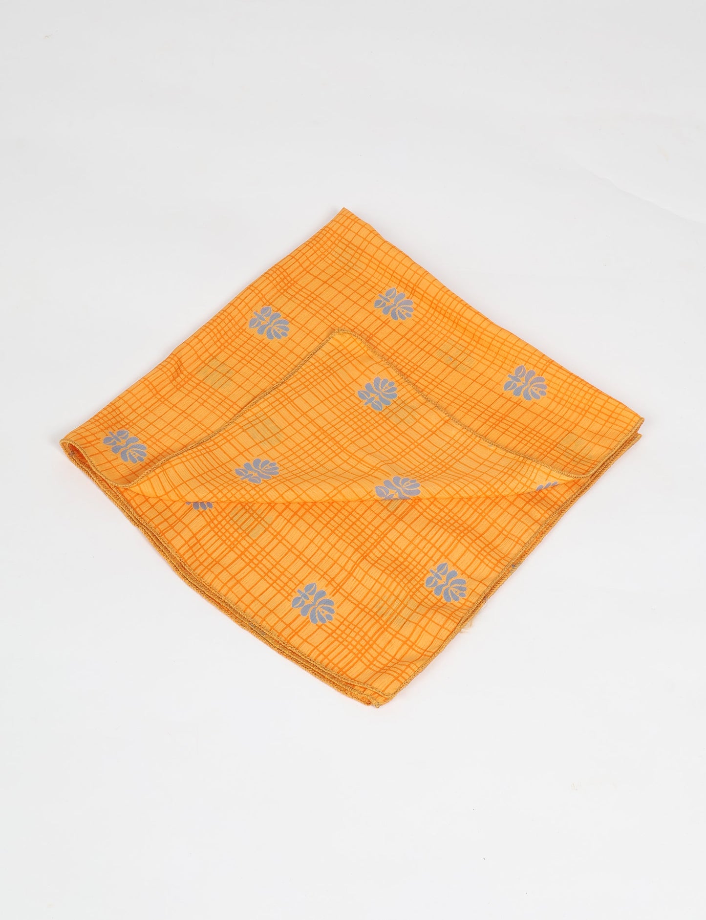 A delicately handcrafted wrap made from recycled sari offcuts, blending sustainable fashion with conscious design. This eco-friendly product showcases the beauty of upcycling and green fashion, making it a perfect accessory for those supporting circular fashion and products made from textile waste.