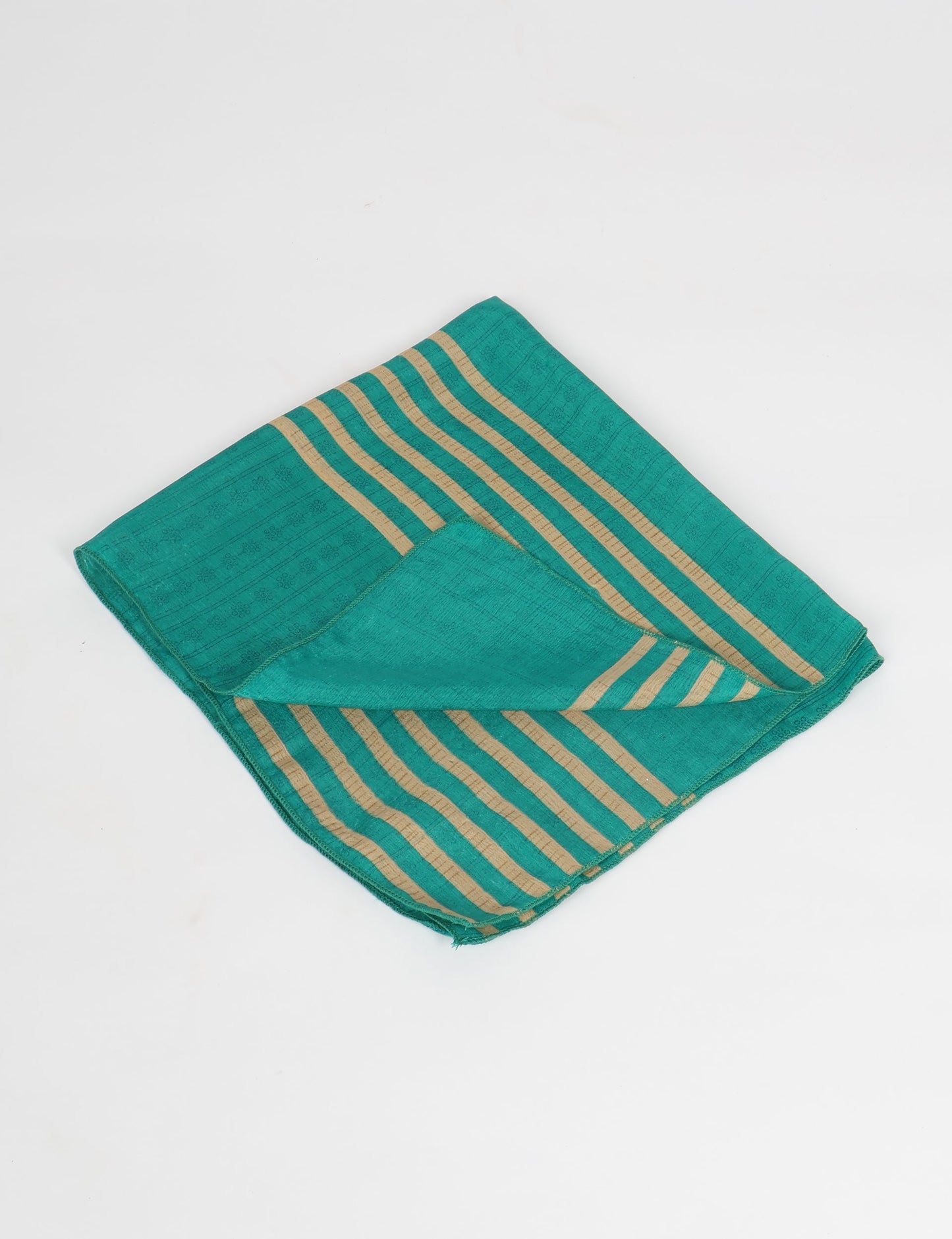 A delicately handcrafted wrap made from recycled sari offcuts, blending sustainable fashion with conscious design. This eco-friendly product showcases the beauty of upcycling and green fashion, making it a perfect accessory for those supporting circular fashion and products made from textile waste.