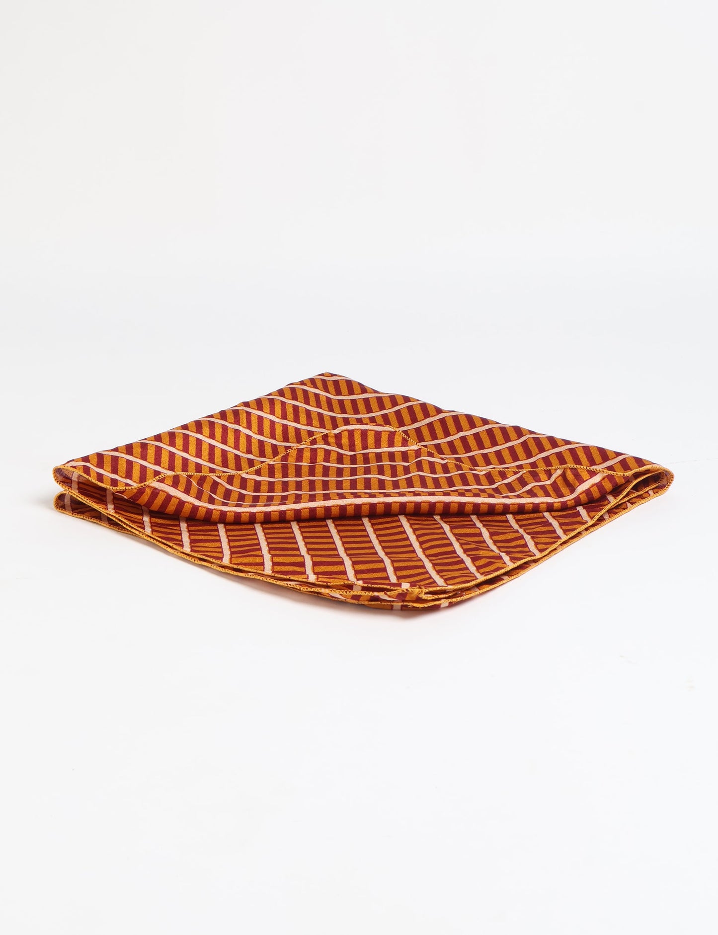 A delicately handcrafted wrap made from recycled sari offcuts, blending sustainable fashion with conscious design. This eco-friendly product showcases the beauty of upcycling and green fashion, making it a perfect accessory for those supporting circular fashion and products made from textile waste.