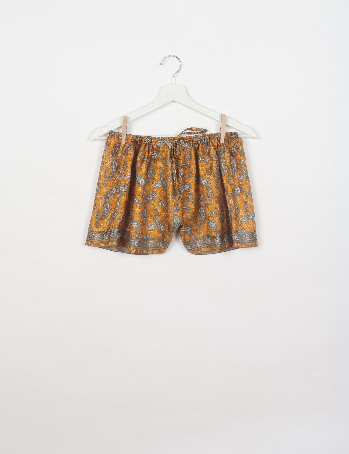 Sleep in eco-friendly luxury with our PJ Set Short. Made for the conscious consumer, these pajamas contribute to zero waste and sustainable practices. The cami top, adorned with delicate eyelash lace and cut on the bias, pairs seamlessly with the comfy shorts featuring an elasticated waist and drawstring tie.