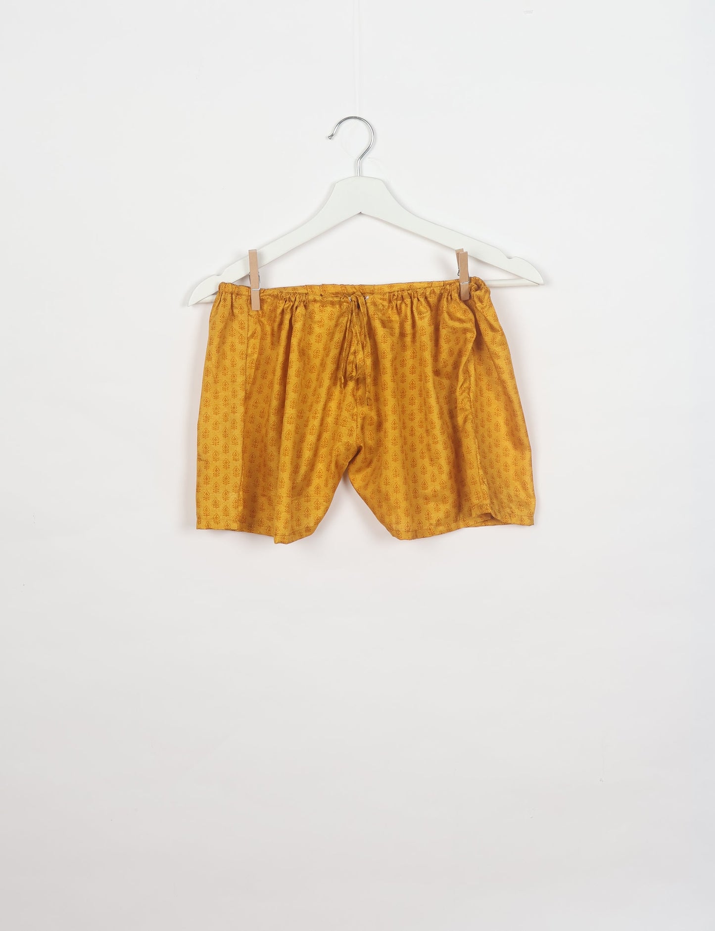 Sleep in eco-friendly luxury with our PJ Set Short. Made for the conscious consumer, these pajamas contribute to zero waste and sustainable practices. The cami top, adorned with delicate eyelash lace and cut on the bias, pairs seamlessly with the comfy shorts featuring an elasticated waist and drawstring tie.