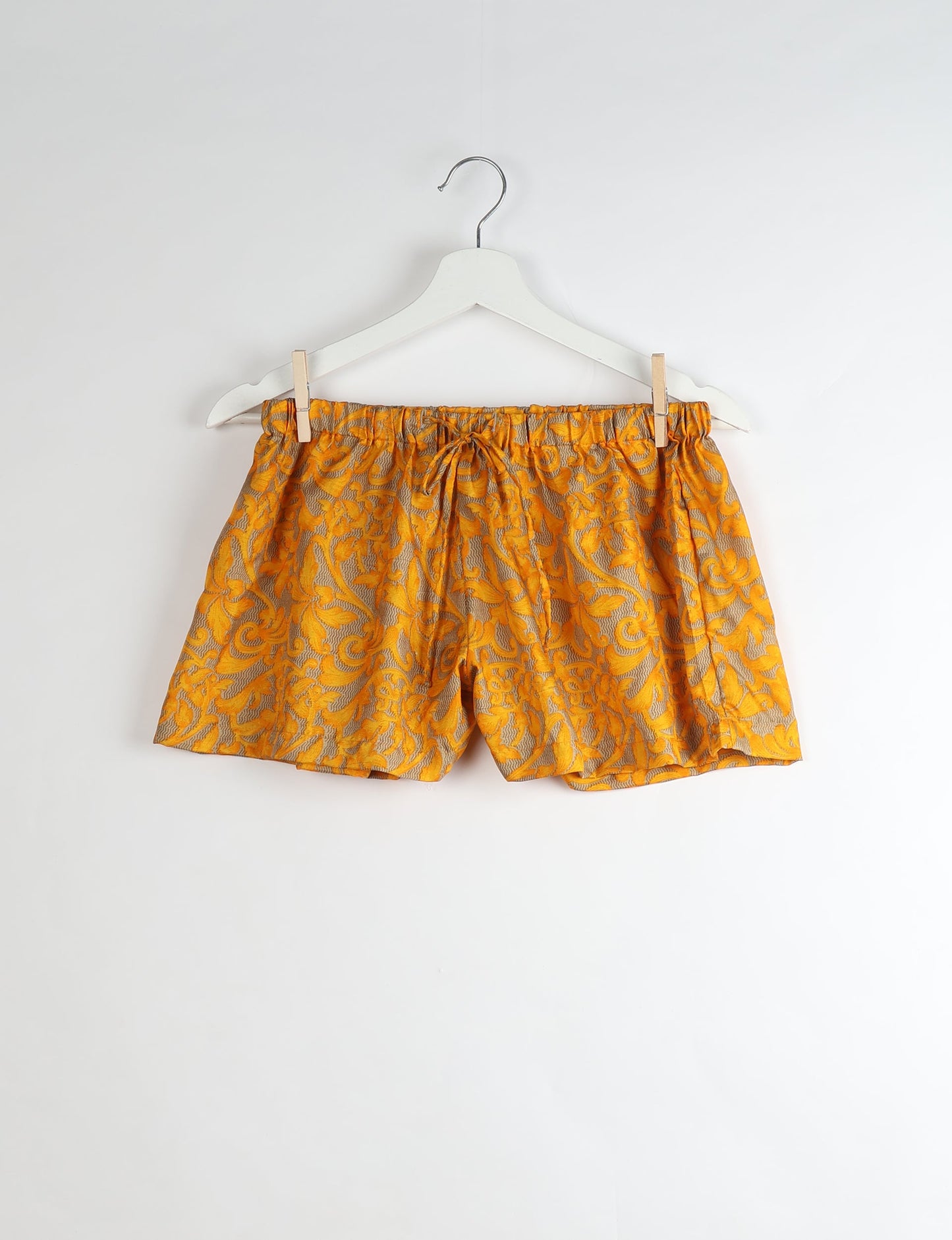 Sleep in eco-friendly luxury with our PJ Set Short. Made for the conscious consumer, these pajamas contribute to zero waste and sustainable practices. The cami top, adorned with delicate eyelash lace and cut on the bias, pairs seamlessly with the comfy shorts featuring an elasticated waist and drawstring tie.