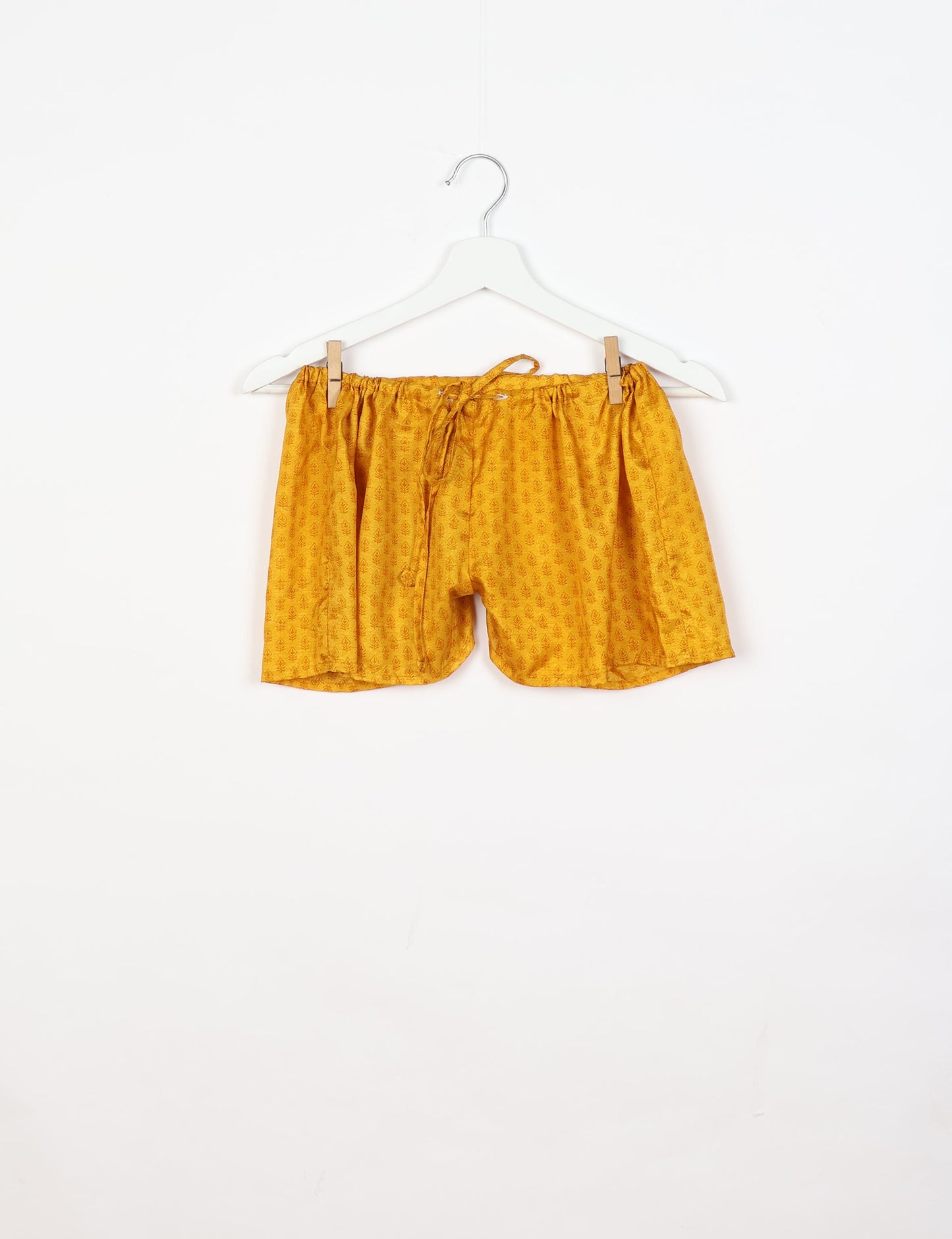 Sleep in eco-friendly luxury with our PJ Set Short. Made for the conscious consumer, these pajamas contribute to zero waste and sustainable practices. The cami top, adorned with delicate eyelash lace and cut on the bias, pairs seamlessly with the comfy shorts featuring an elasticated waist and drawstring tie.