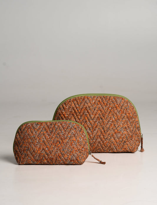 A set of two Vanity Pouches, featuring embellished beaded pullers, made from sustainable materials for eco-conscious travelers.