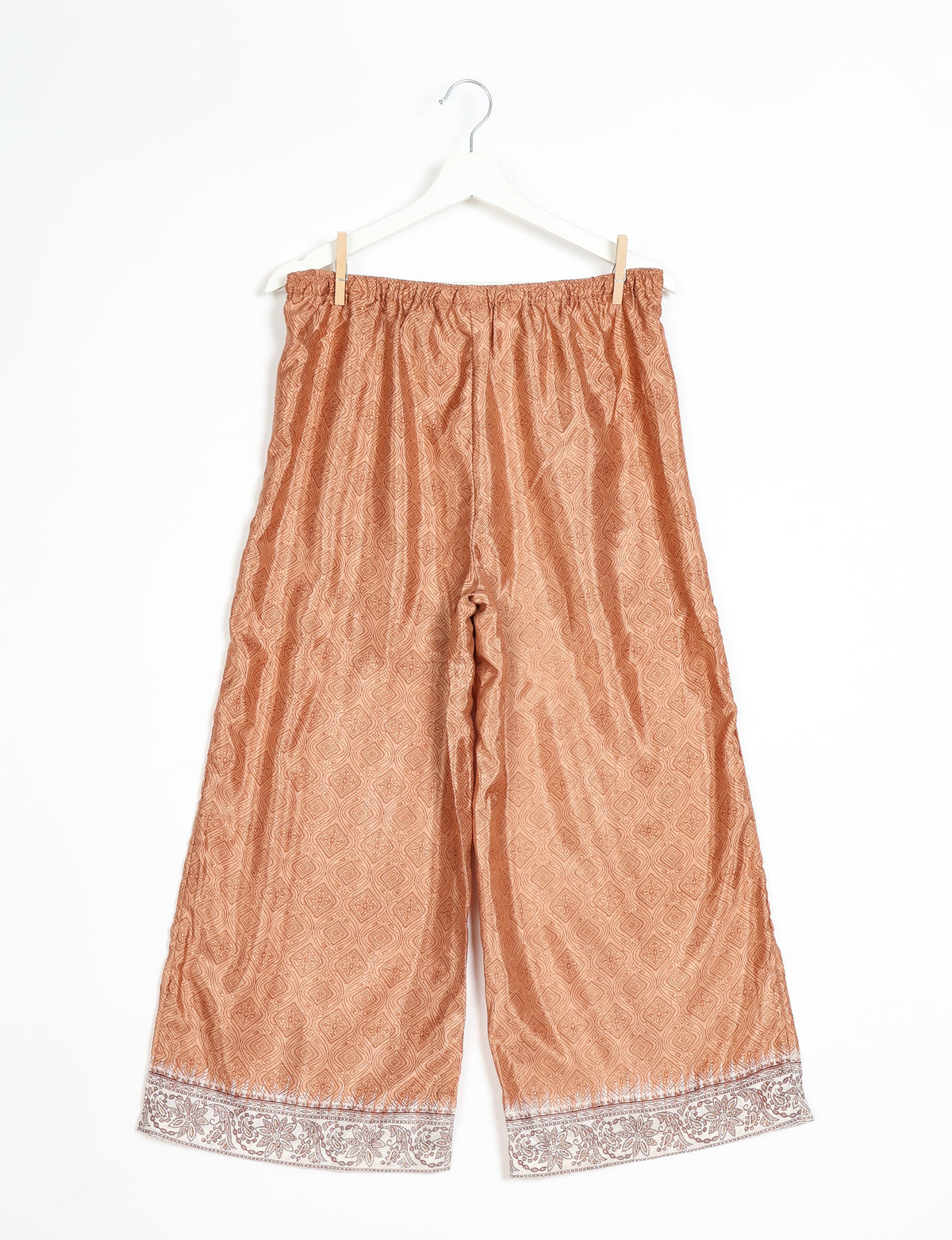 Step into sustainable fashion with our Palazzo Pants – a harmonious blend of Indian and Italian influences. These wide-legged pants, made from upcycled saris, offer comfort with an all-around elastic waist and a stylish flared leg. Make a statement with eco-friendly, chic palazzo pants that redefine ethical clothing.