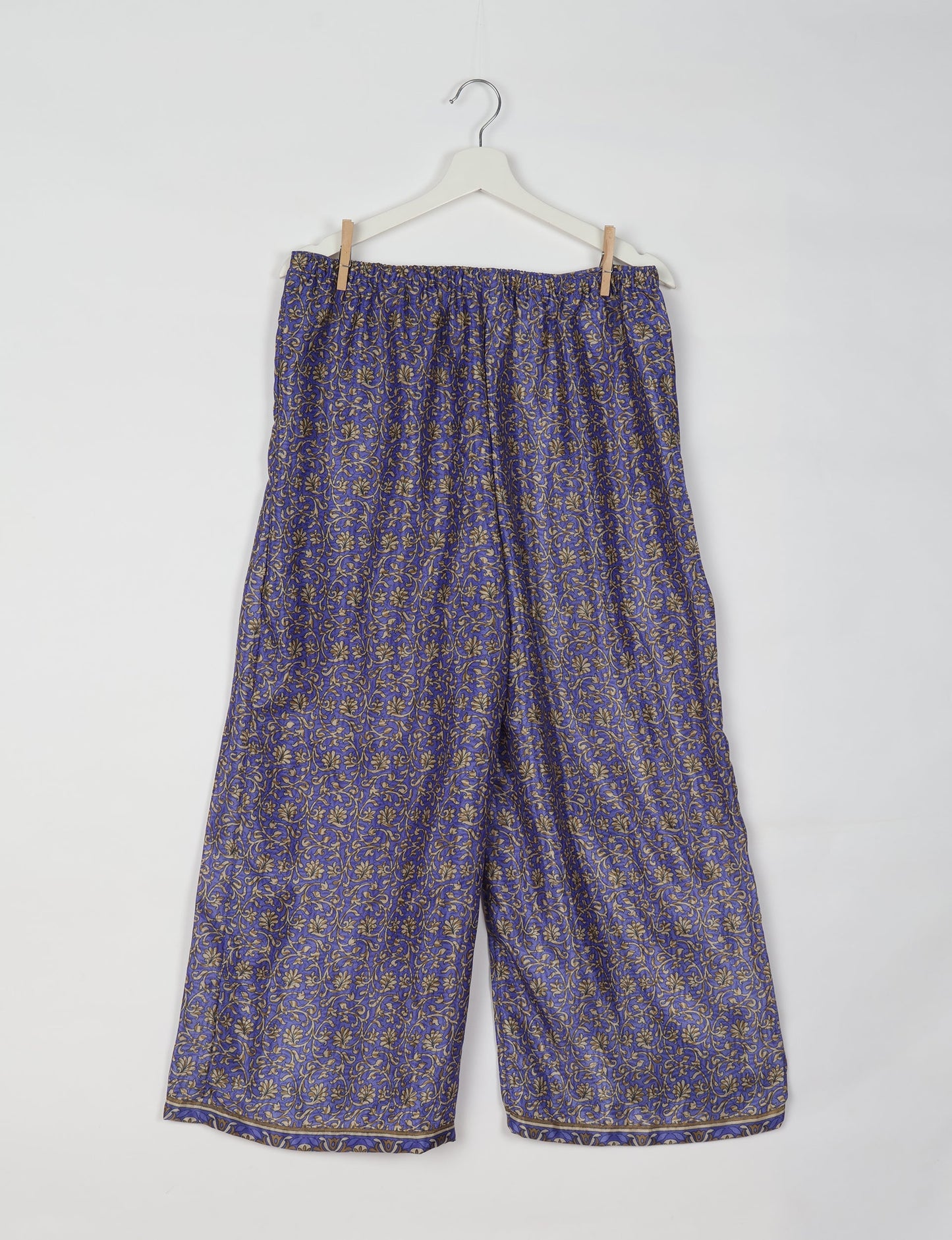Step into sustainable fashion with our Palazzo Pants – a harmonious blend of Indian and Italian influences. These wide-legged pants, made from upcycled saris, offer comfort with an all-around elastic waist and a stylish flared leg. Make a statement with eco-friendly, chic palazzo pants that redefine ethical clothing.