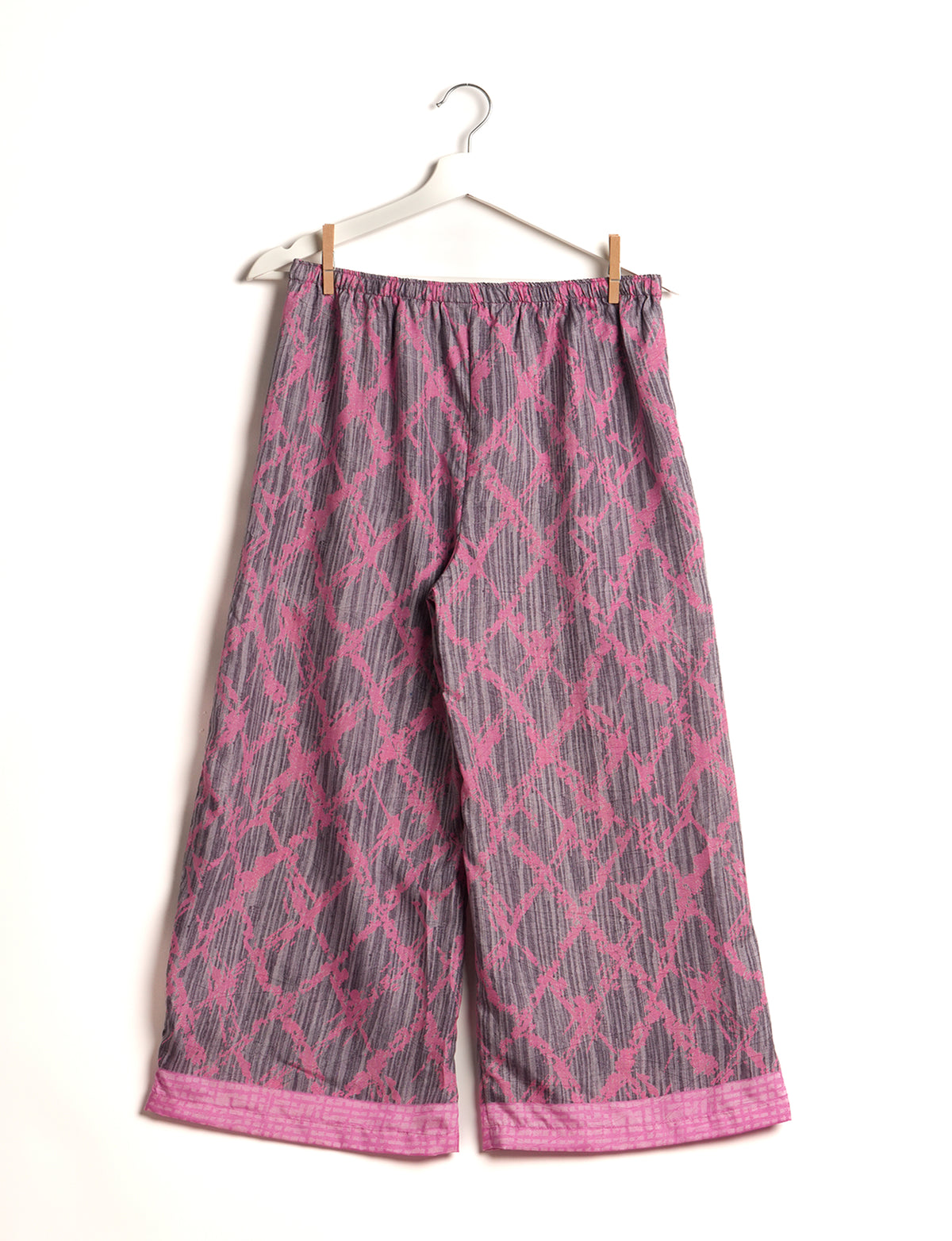 Step into sustainable fashion with our Palazzo Pants – a harmonious blend of Indian and Italian influences. These wide-legged pants, made from upcycled saris, offer comfort with an all-around elastic waist and a stylish flared leg. Make a statement with eco-friendly, chic palazzo pants that redefine ethical clothing.