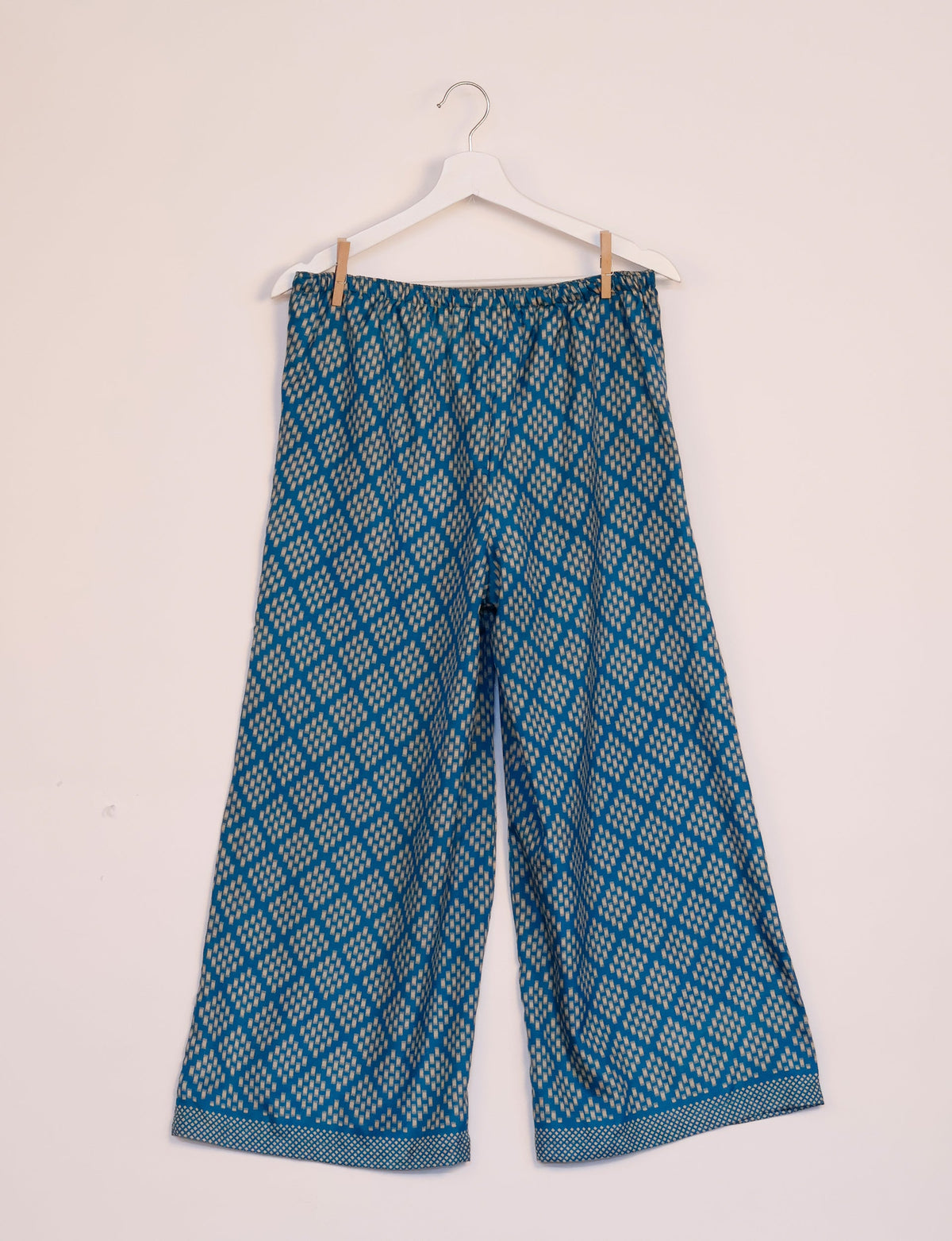 Step into sustainable fashion with our Palazzo Pants – a harmonious blend of Indian and Italian influences. These wide-legged pants, made from upcycled saris, offer comfort with an all-around elastic waist and a stylish flared leg. Make a statement with eco-friendly, chic palazzo pants that redefine ethical clothing.