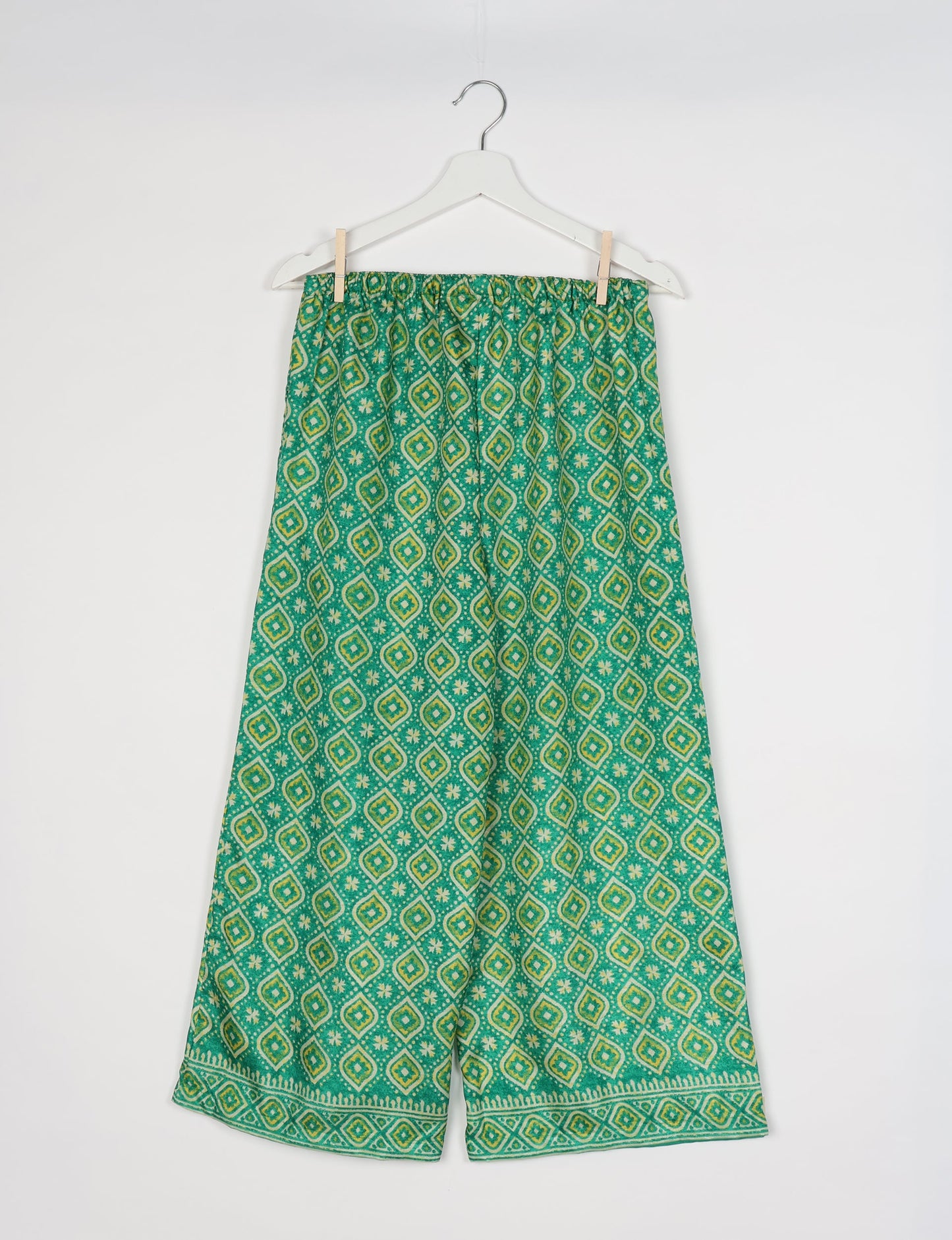Step into sustainable fashion with our Palazzo Pants – a harmonious blend of Indian and Italian influences. These wide-legged pants, made from upcycled saris, offer comfort with an all-around elastic waist and a stylish flared leg. Make a statement with eco-friendly, chic palazzo pants that redefine ethical clothing.