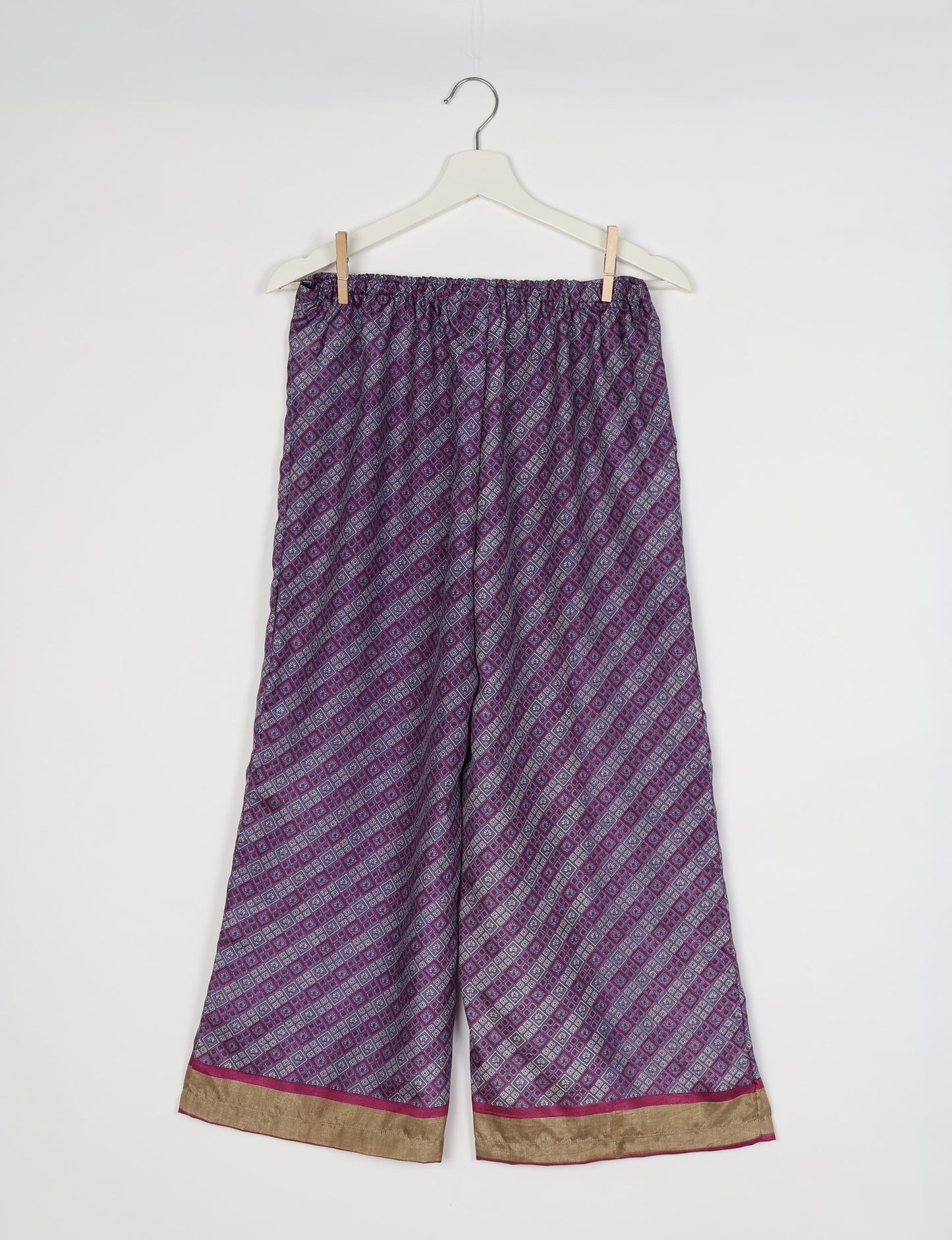 Step into sustainable fashion with our Palazzo Pants – a harmonious blend of Indian and Italian influences. These wide-legged pants, made from upcycled saris, offer comfort with an all-around elastic waist and a stylish flared leg. Make a statement with eco-friendly, chic palazzo pants that redefine ethical clothing.