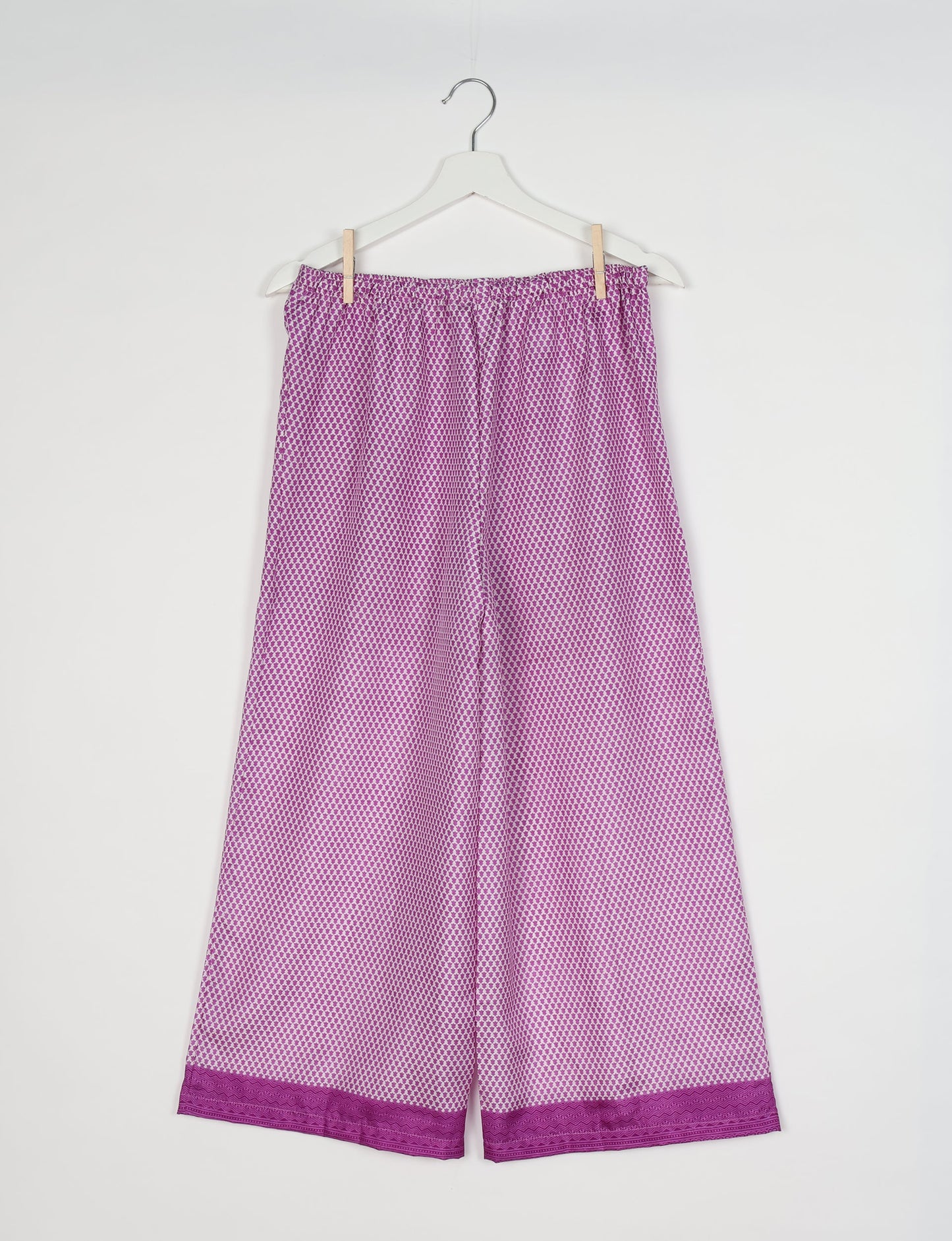 Step into sustainable fashion with our Palazzo Pants – a harmonious blend of Indian and Italian influences. These wide-legged pants, made from upcycled saris, offer comfort with an all-around elastic waist and a stylish flared leg. Make a statement with eco-friendly, chic palazzo pants that redefine ethical clothing.