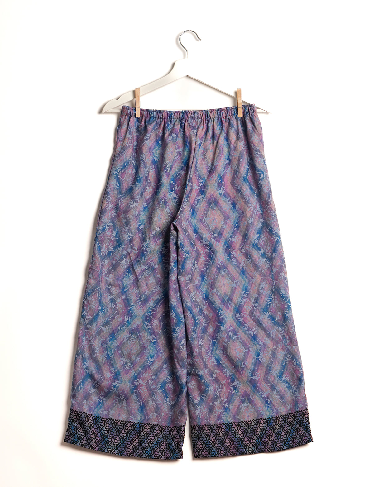 Step into sustainable fashion with our Palazzo Pants – a harmonious blend of Indian and Italian influences. These wide-legged pants, made from upcycled saris, offer comfort with an all-around elastic waist and a stylish flared leg. Make a statement with eco-friendly, chic palazzo pants that redefine ethical clothing.