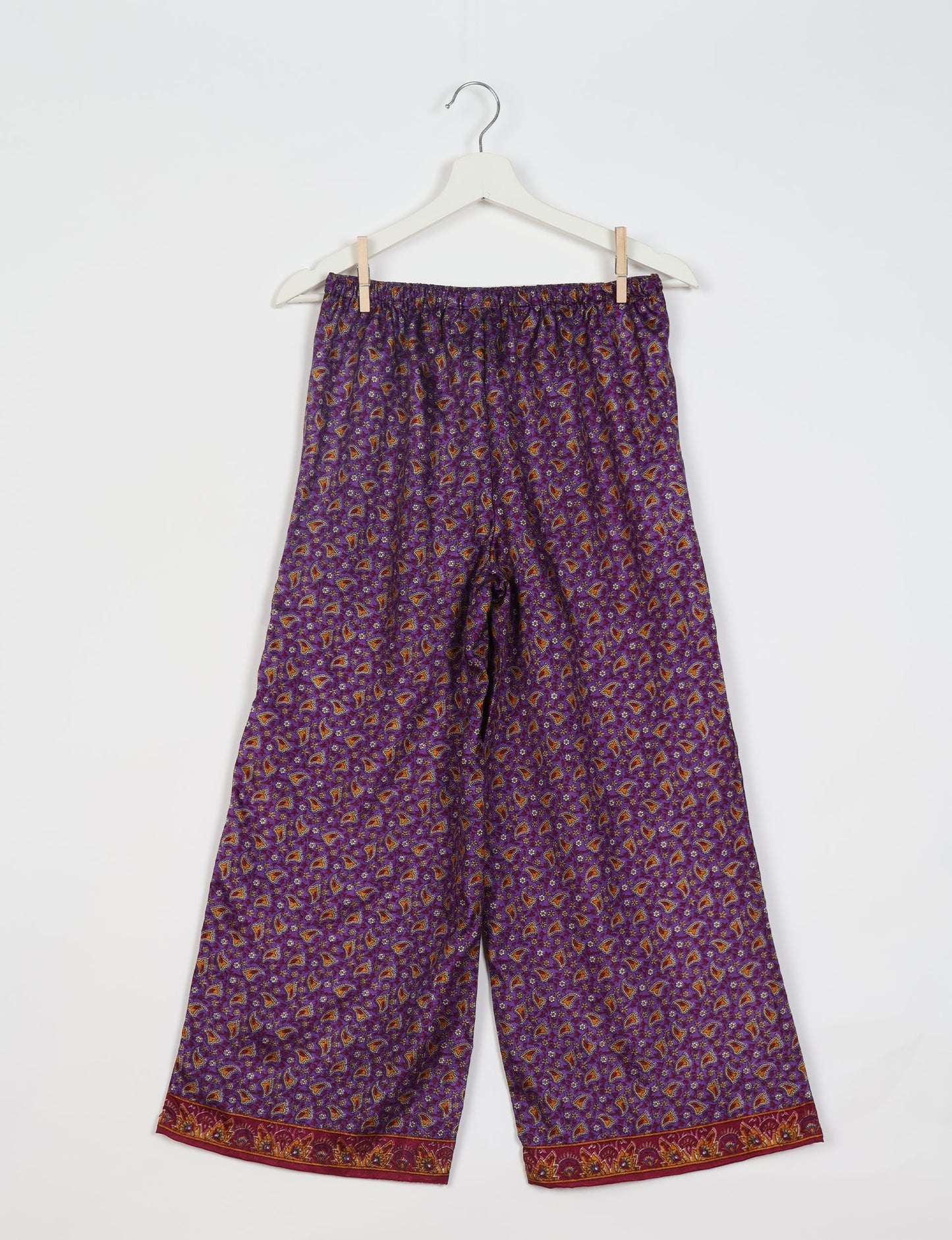 Step into sustainable fashion with our Palazzo Pants – a harmonious blend of Indian and Italian influences. These wide-legged pants, made from upcycled saris, offer comfort with an all-around elastic waist and a stylish flared leg. Make a statement with eco-friendly, chic palazzo pants that redefine ethical clothing.
