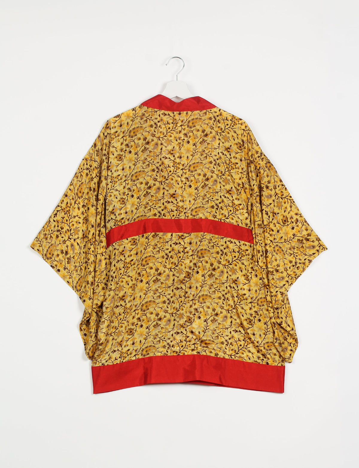 Radiant and sustainably crafted KIMONO with humble beginnings from the streets of India. Versatile and eco-friendly layering piece for casual trousers, swimwear, or our spaghetti strap dress. Embrace conscious fashion and sustainable style with this unique and culturally inspired kimono, sure to invite compliments.