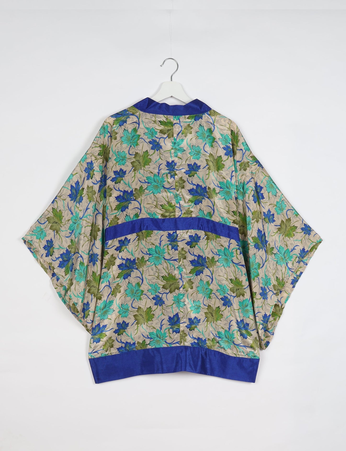 Radiant and sustainably crafted KIMONO with humble beginnings from the streets of India. Versatile and eco-friendly layering piece for casual trousers, swimwear, or our spaghetti strap dress. Embrace conscious fashion and sustainable style with this unique and culturally inspired kimono, sure to invite compliments.