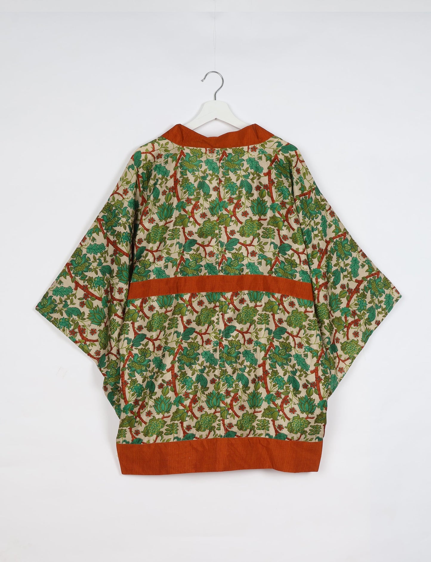 Radiant and sustainably crafted KIMONO with humble beginnings from the streets of India. Versatile and eco-friendly layering piece for casual trousers, swimwear, or our spaghetti strap dress. Embrace conscious fashion and sustainable style with this unique and culturally inspired kimono, sure to invite compliments.