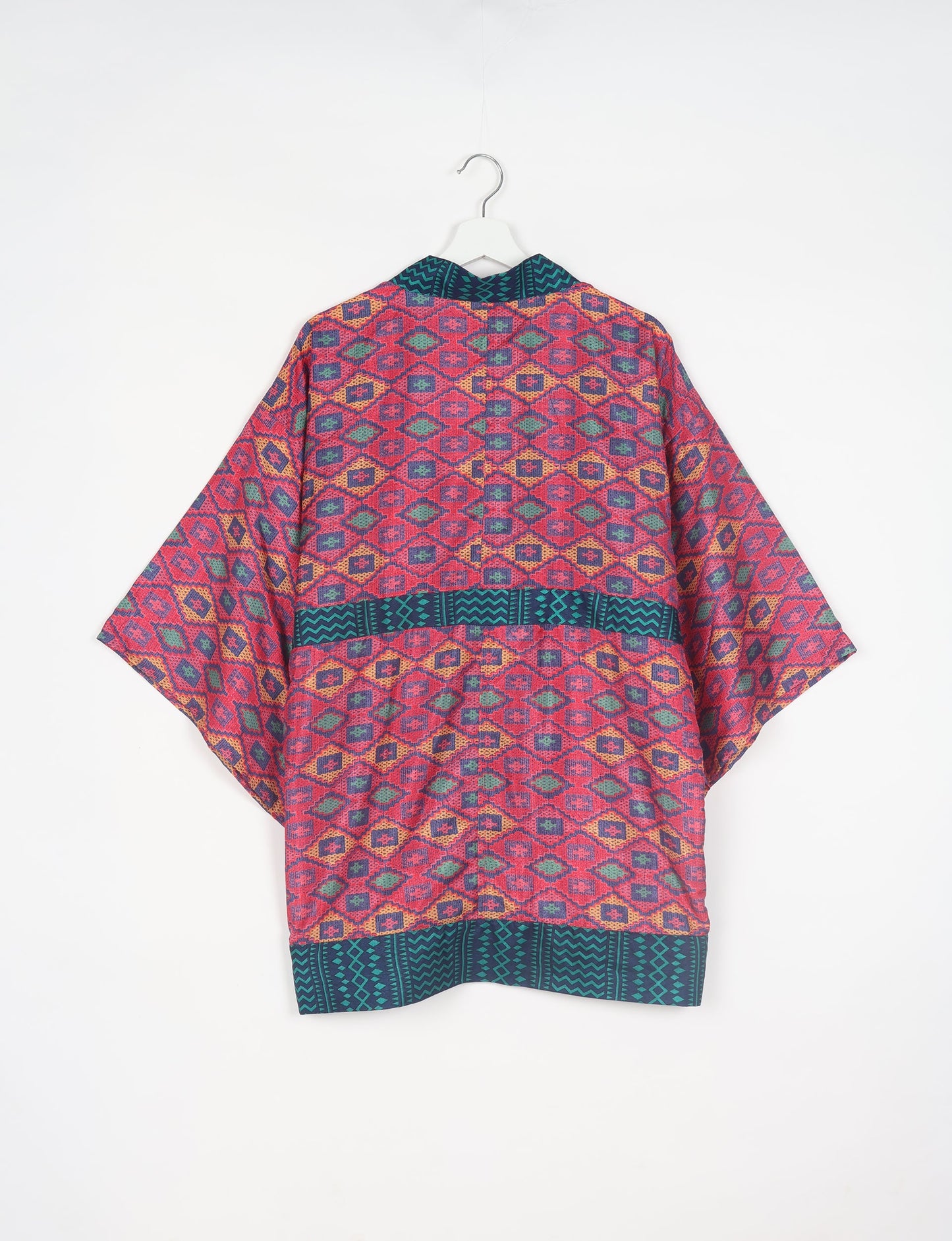 Radiant and sustainably crafted KIMONO with humble beginnings from the streets of India. Versatile and eco-friendly layering piece for casual trousers, swimwear, or our spaghetti strap dress. Embrace conscious fashion and sustainable style with this unique and culturally inspired kimono, sure to invite compliments.