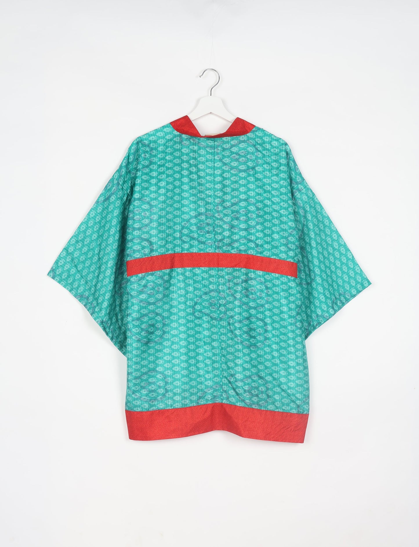 Radiant and sustainably crafted KIMONO with humble beginnings from the streets of India. Versatile and eco-friendly layering piece for casual trousers, swimwear, or our spaghetti strap dress. Embrace conscious fashion and sustainable style with this unique and culturally inspired kimono, sure to invite compliments.