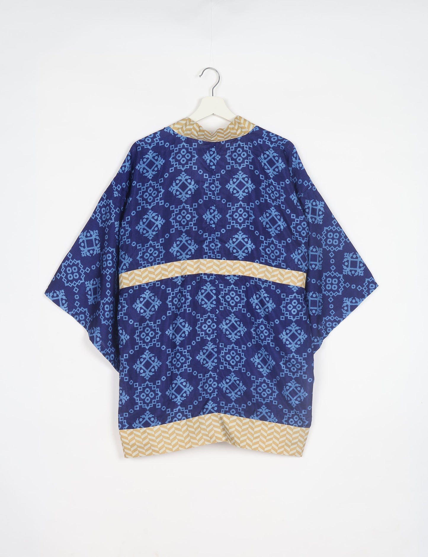 Radiant and sustainably crafted KIMONO with humble beginnings from the streets of India. Versatile and eco-friendly layering piece for casual trousers, swimwear, or our spaghetti strap dress. Embrace conscious fashion and sustainable style with this unique and culturally inspired kimono, sure to invite compliments.