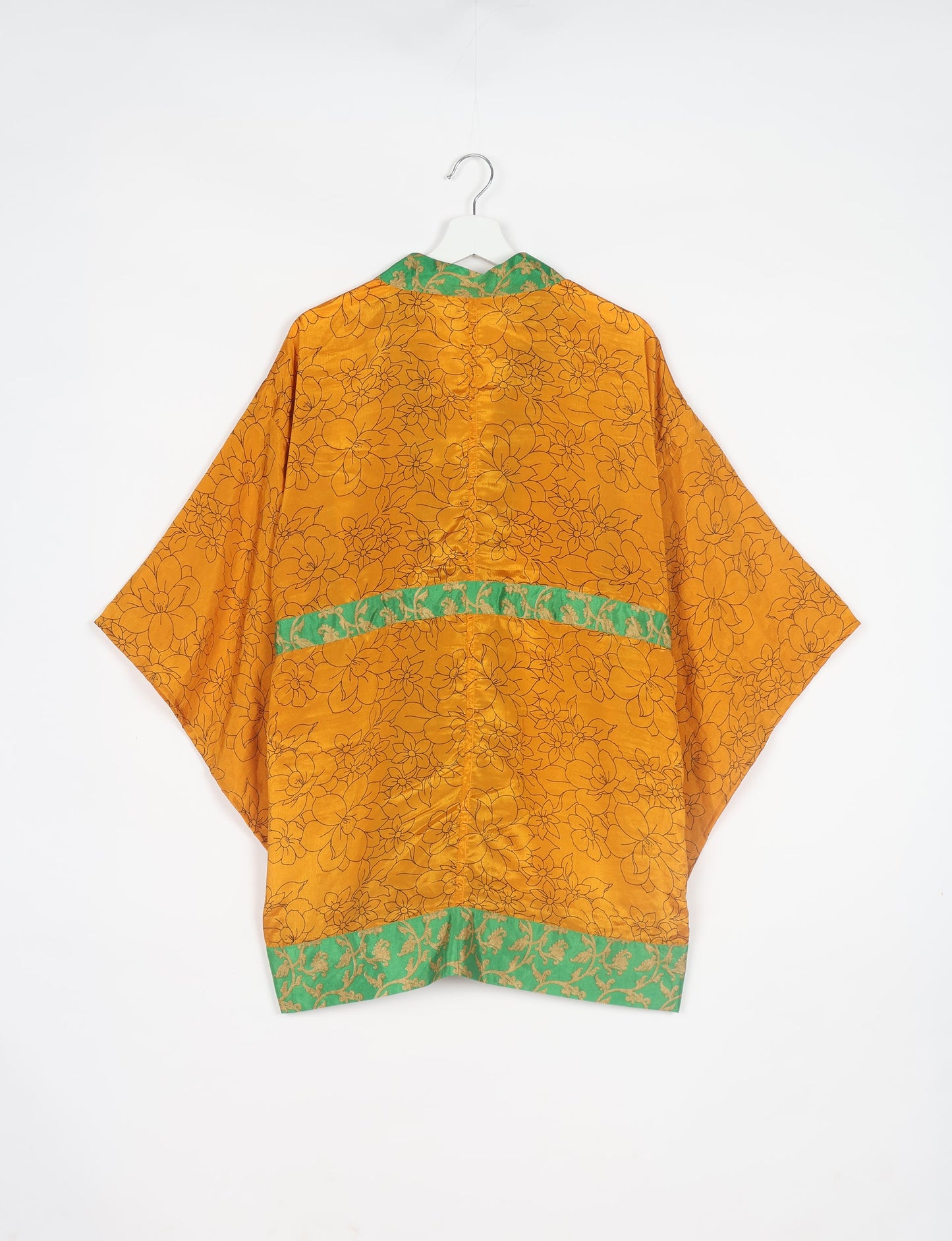 Radiant and sustainably crafted KIMONO with humble beginnings from the streets of India. Versatile and eco-friendly layering piece for casual trousers, swimwear, or our spaghetti strap dress. Embrace conscious fashion and sustainable style with this unique and culturally inspired kimono, sure to invite compliments.