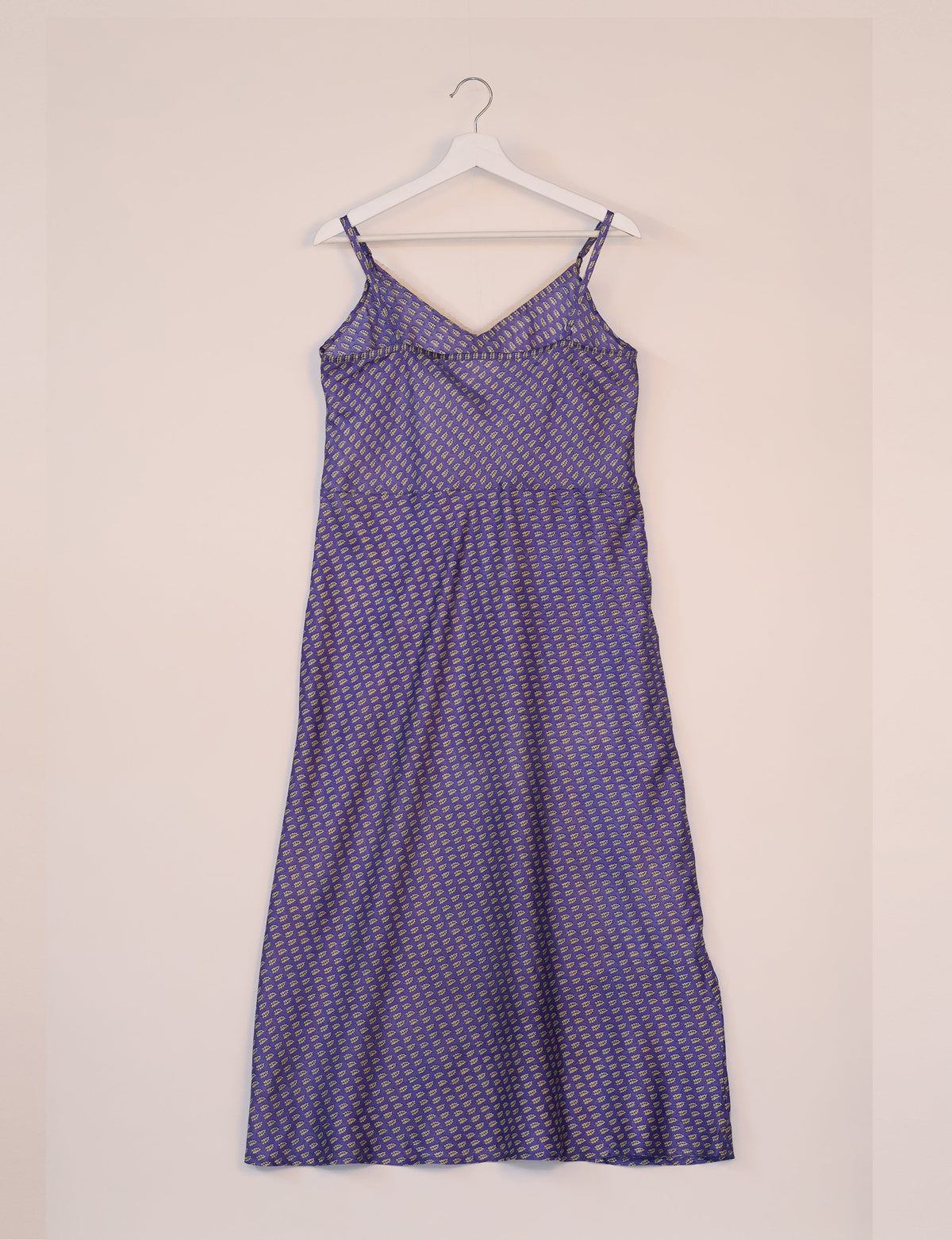 Spaghetti strap dress made from sustainable materials, embodying ethical fashion principles. Ideal for eco-friendly travelers seeking laid-back style.
