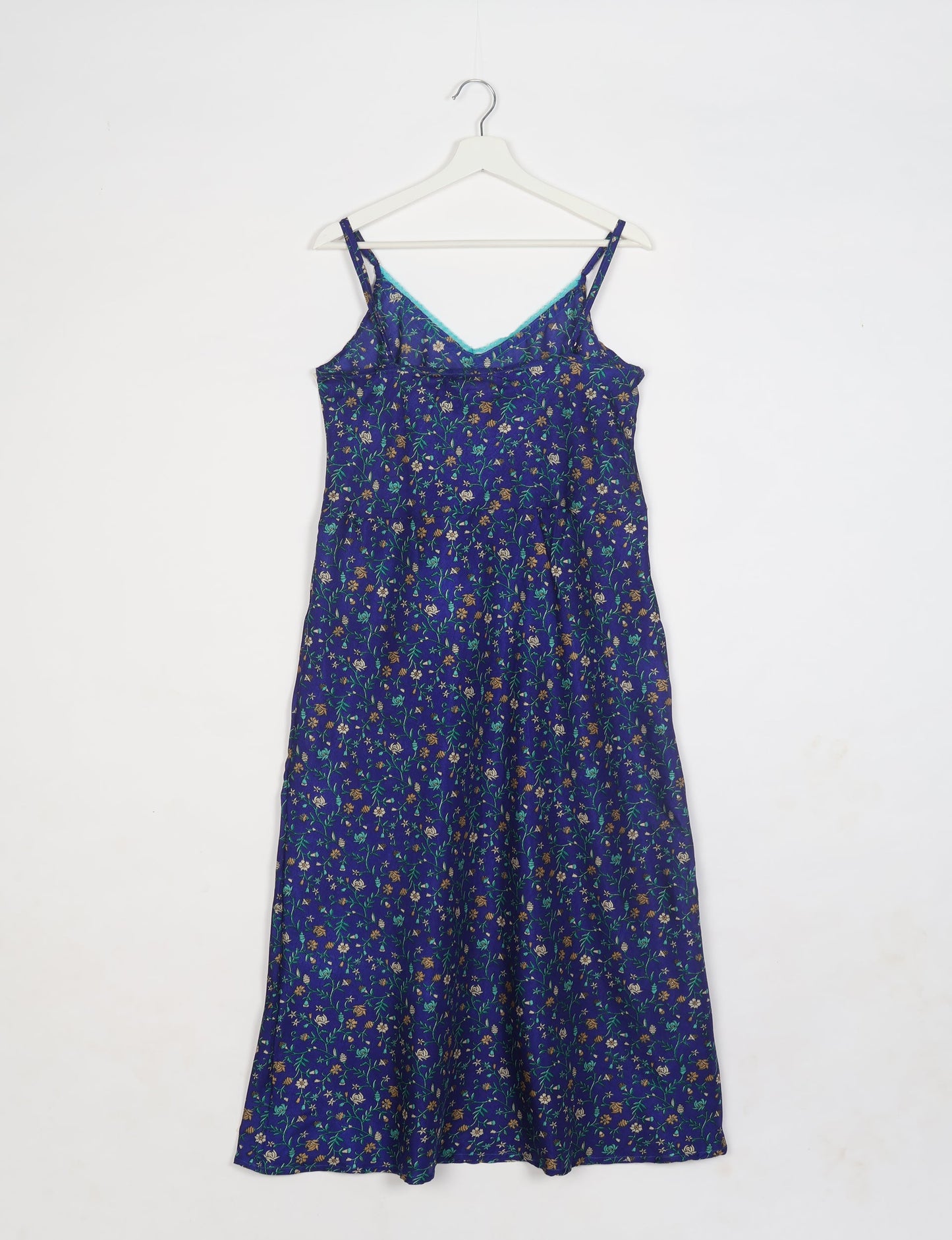 Spaghetti strap dress made from sustainable materials, embodying ethical fashion principles. Ideal for eco-friendly travelers seeking laid-back style.